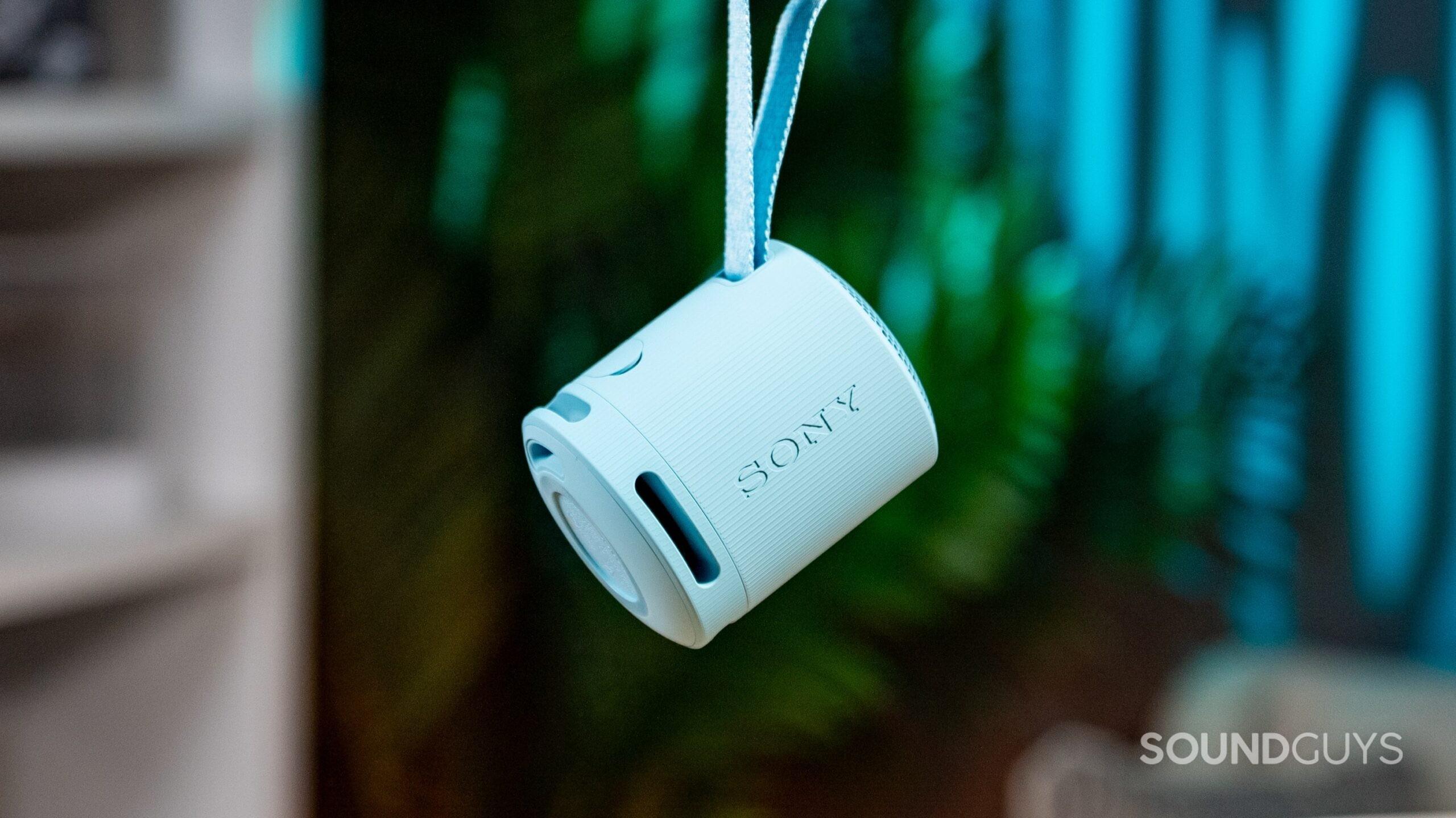 The Sony SRS-XB100 hanging from its strap.
