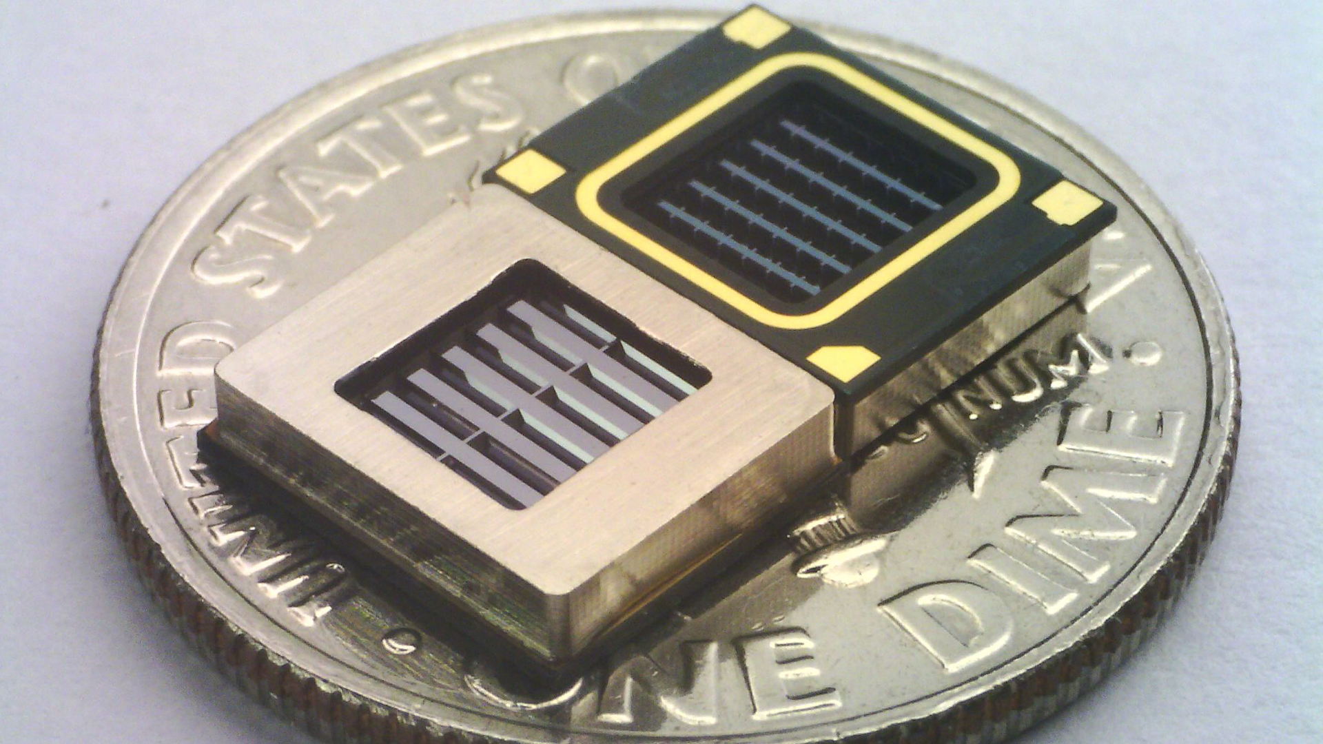 A manufacturer photo of the 2 of the xMEMS Cypress speaker units on a dime.