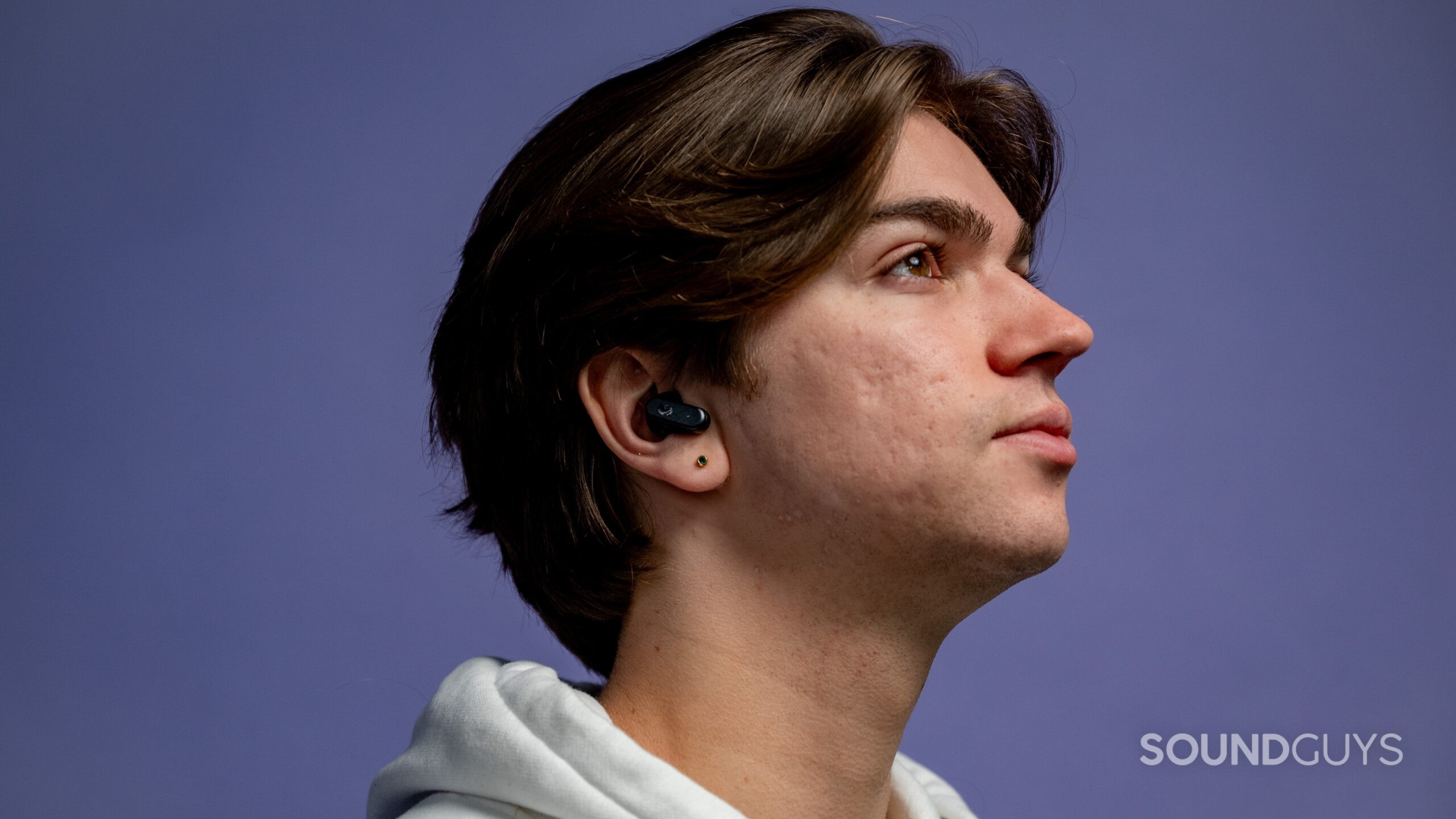 Skullcandy Dime 3 earbuds on a model.