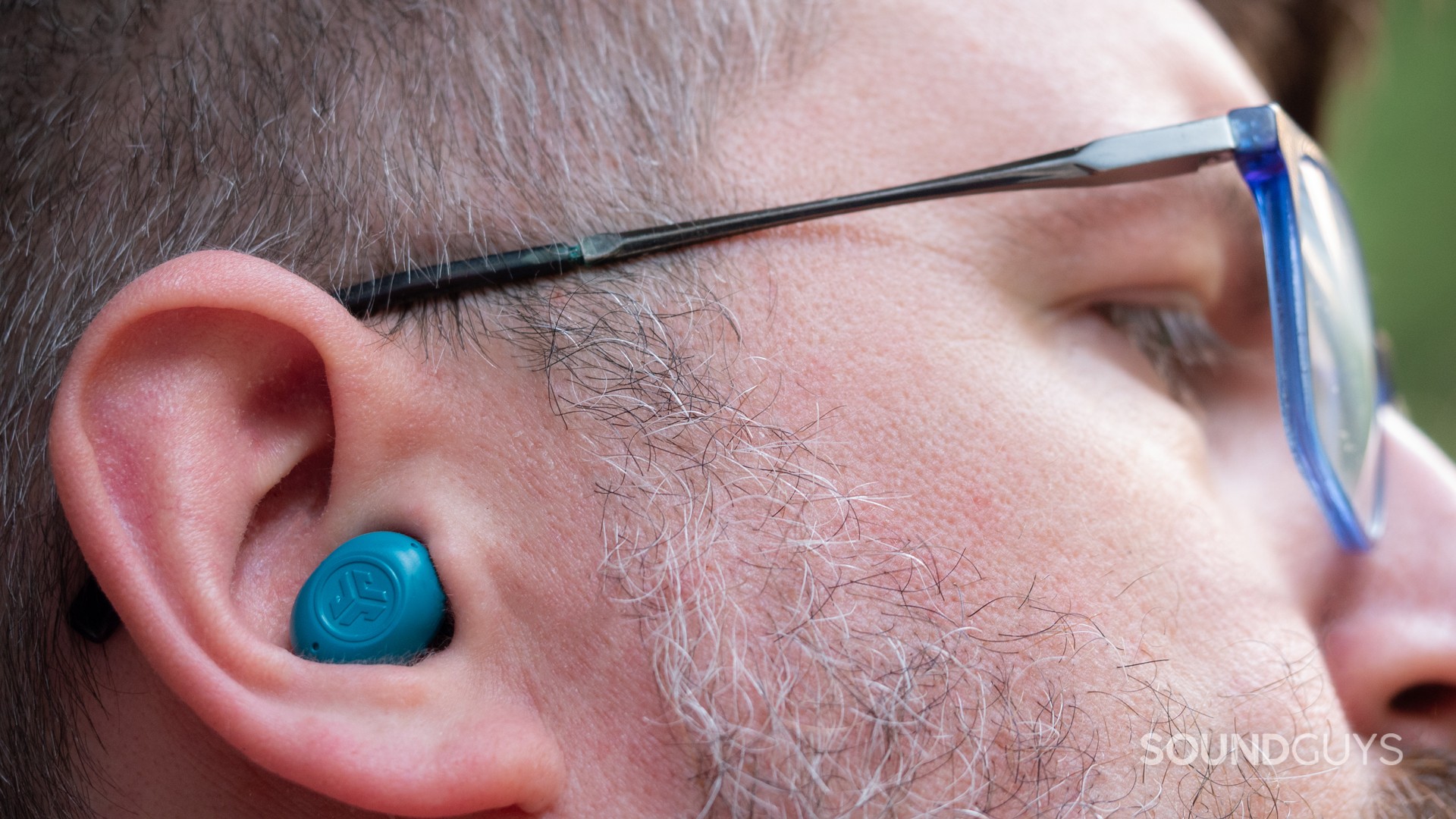 A man wearing the JLab JBuds Mini.