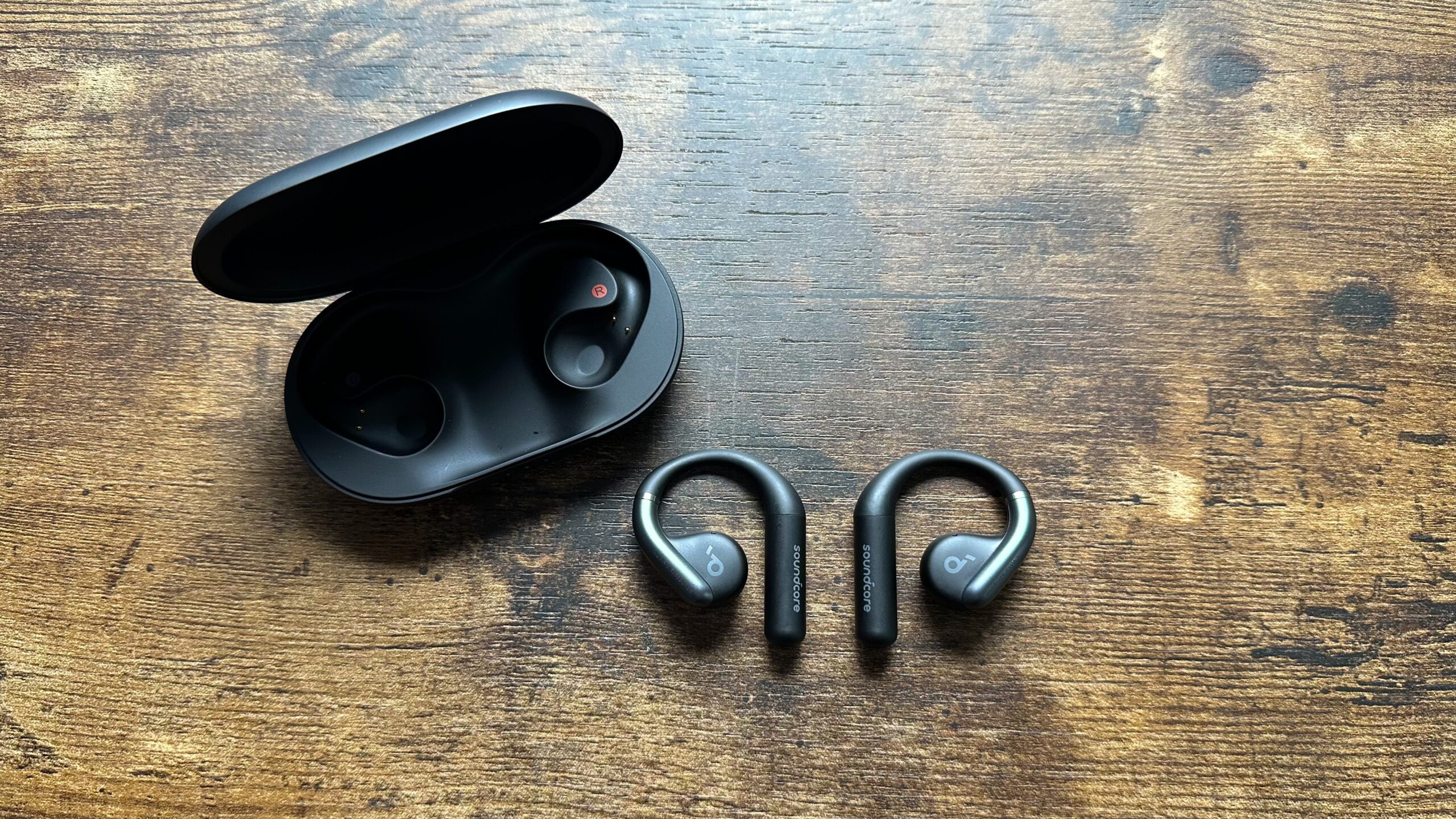 The AeroFit earbuds and charging case.