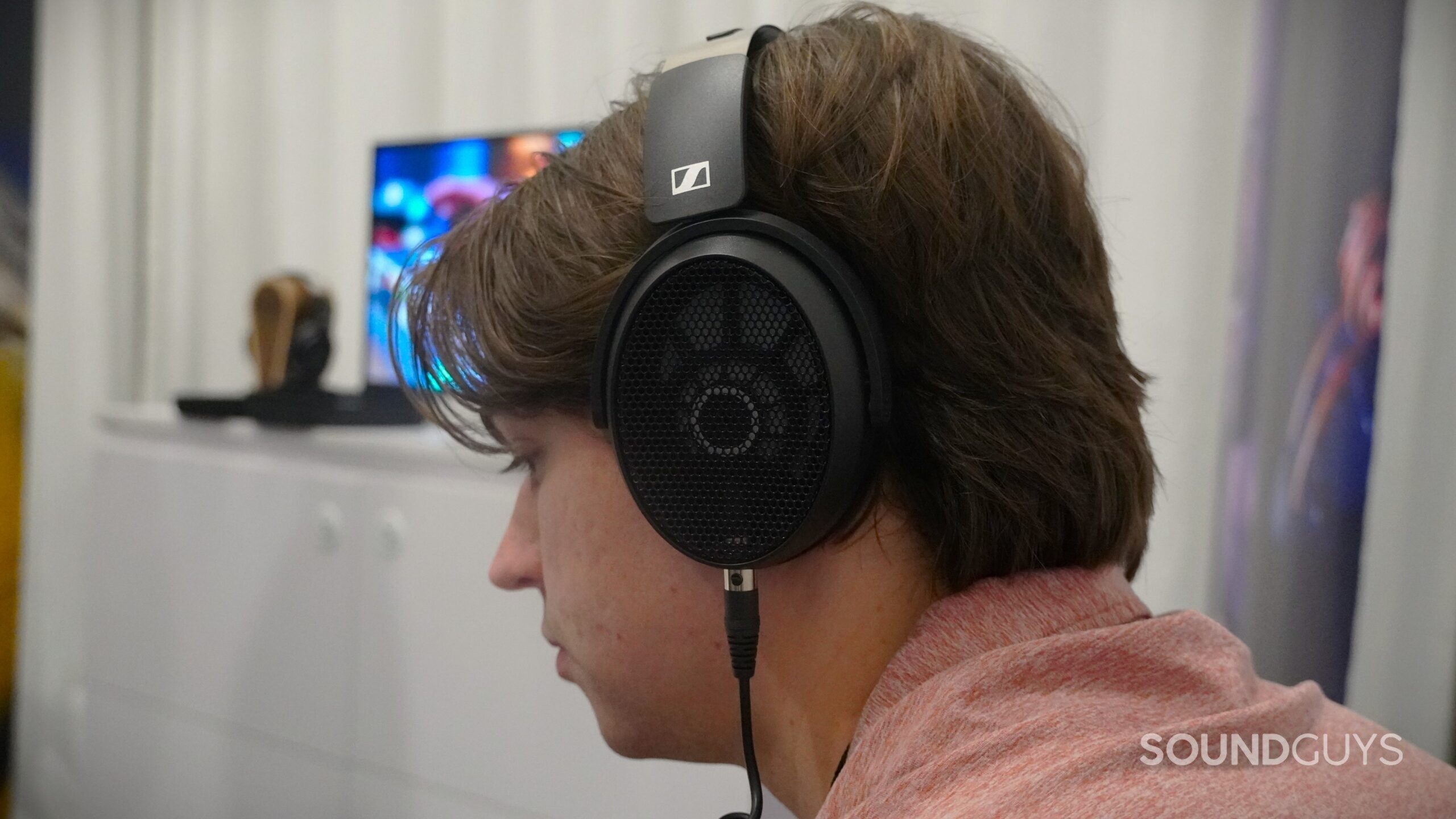 a man wearing the sennheiser hd 490 pro open back headphones