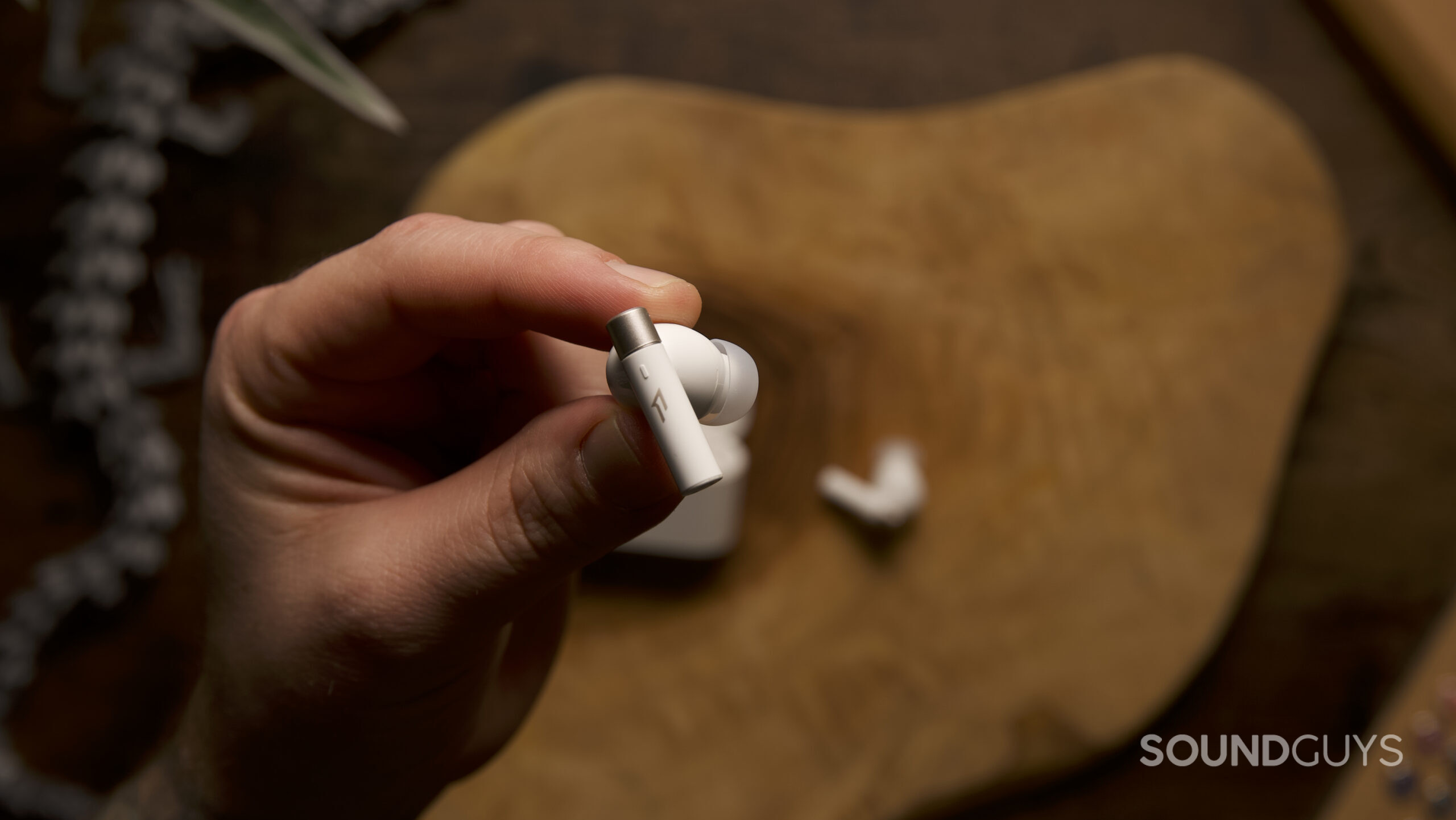 Top view of a single PistonBuds PRO Q30 earbud.