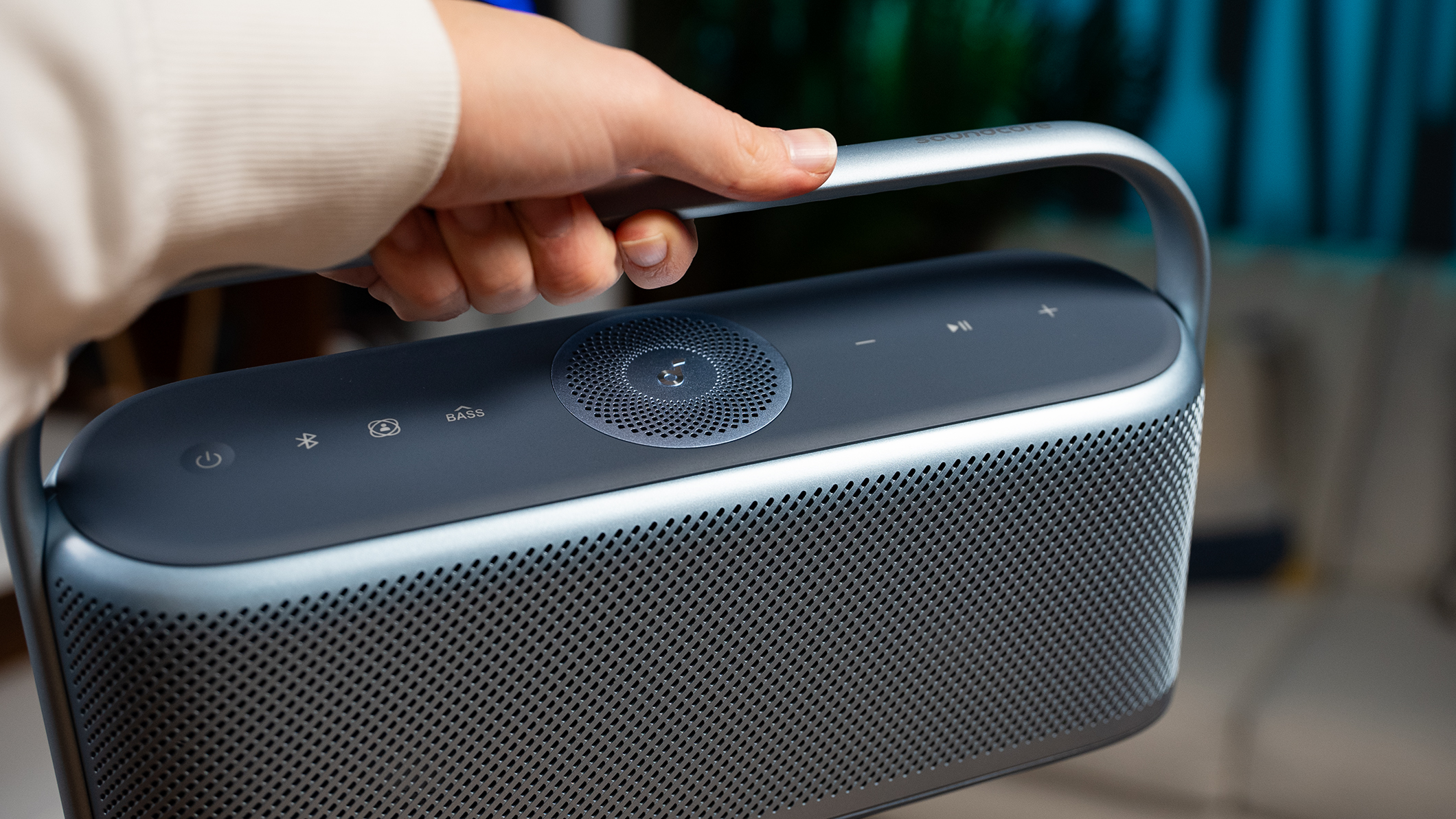 Anker Soundcore Motion X600 held by a hand. 