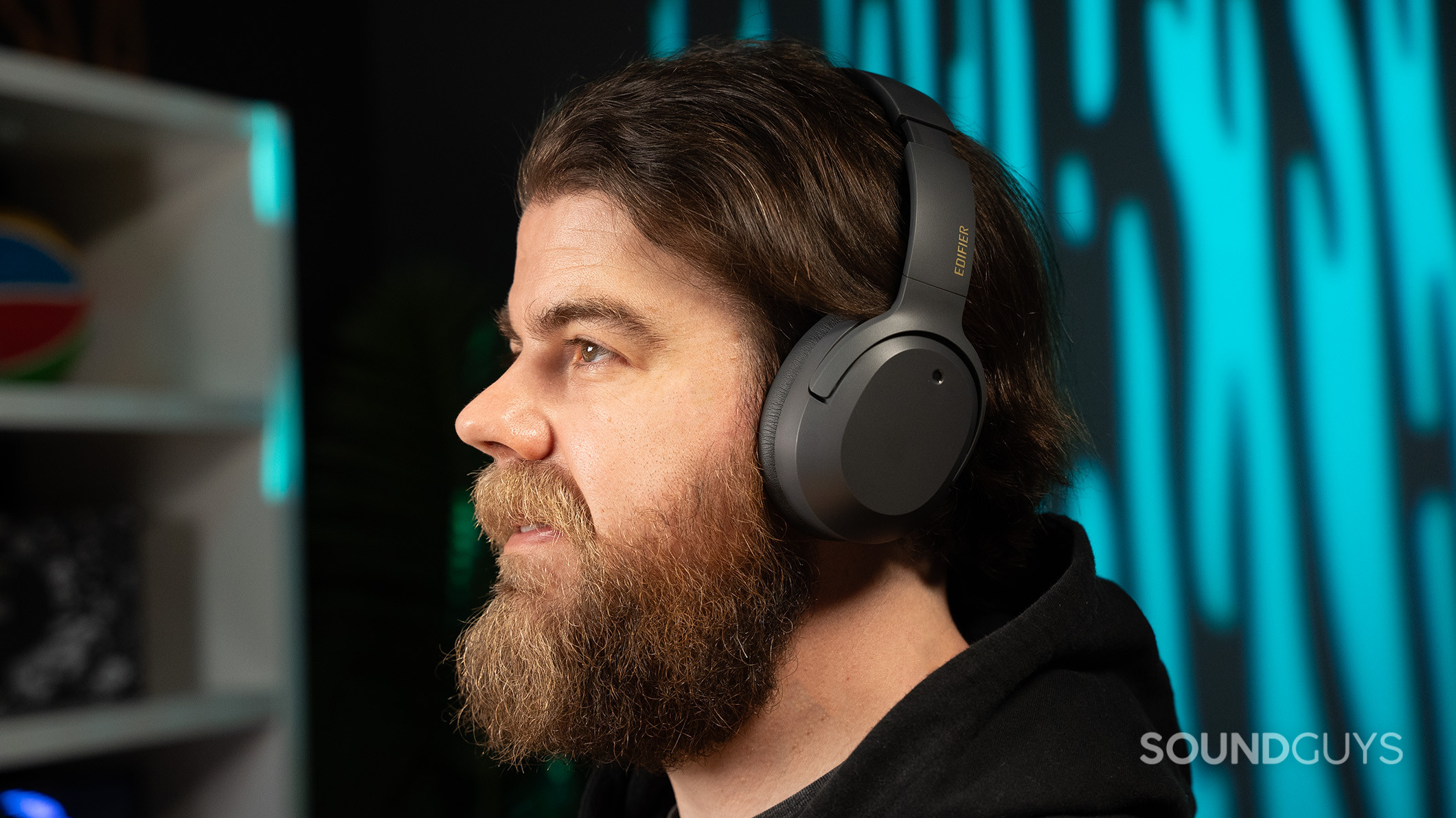 Side profile view of a man wearing the Edifier W820NB Plus headphones