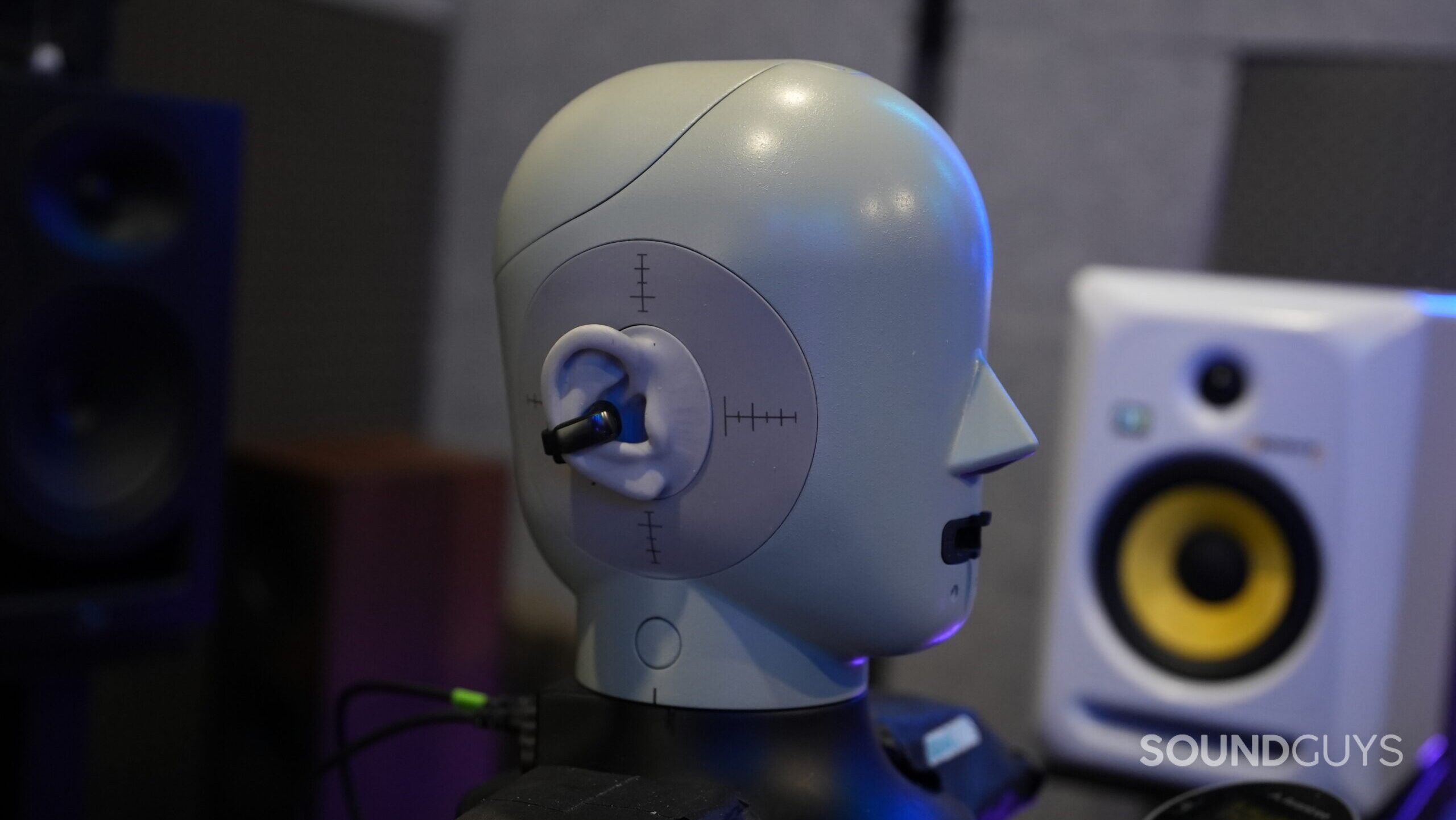 A photo of the Bose Ultra Open Ear earbuds on a testing head