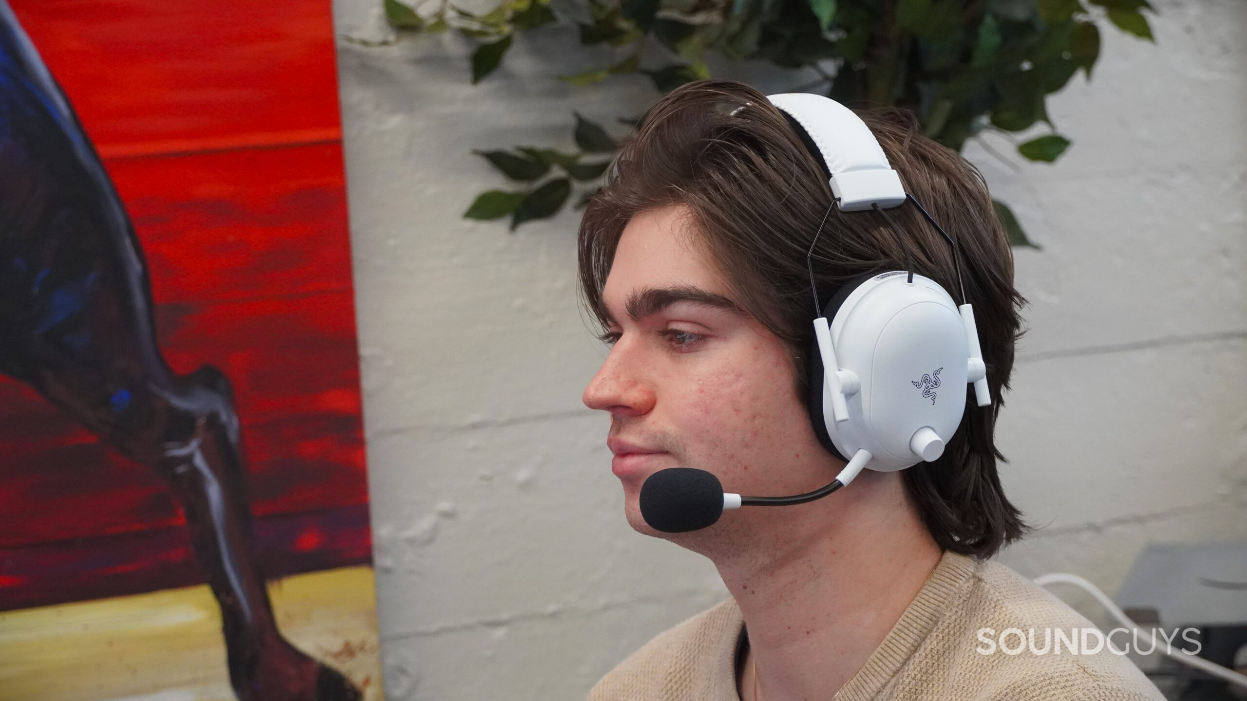 A man wearing the Razer BlackShark V2 Pro with microphone