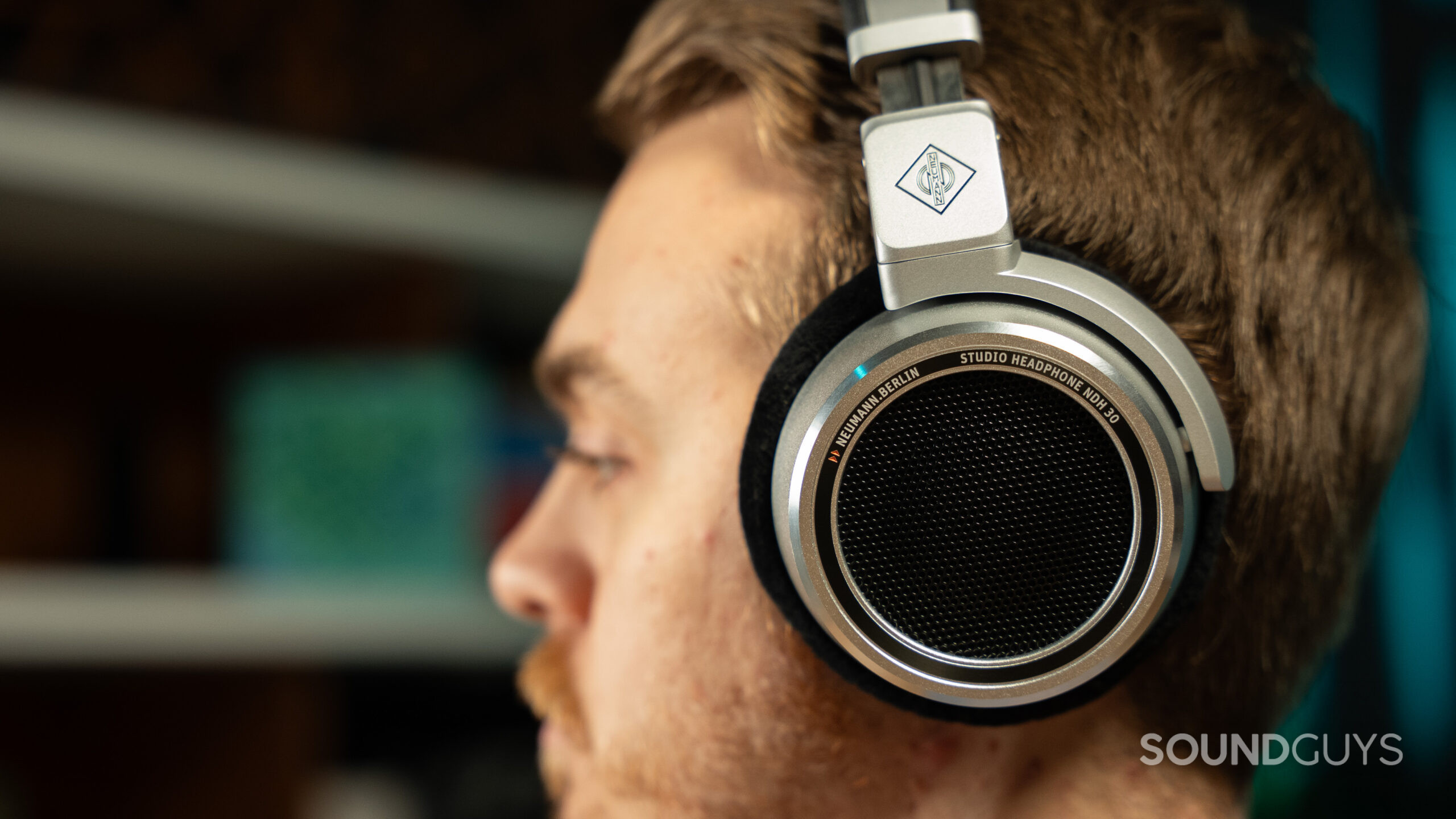 Neumann NDH 30 headphones on a man looking left.