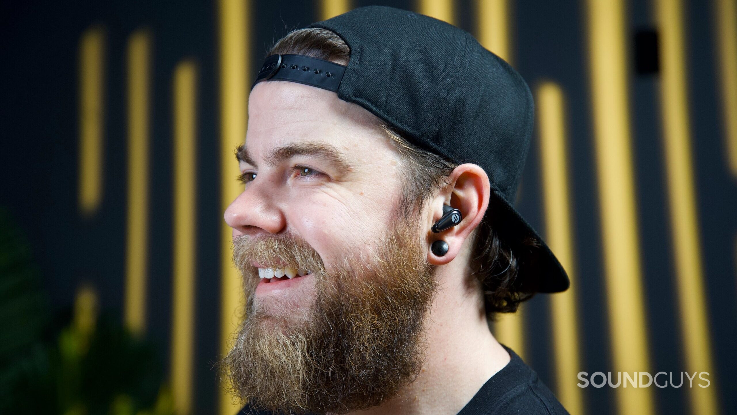 A man wearing the Raycon Everyday Earbuds Pro