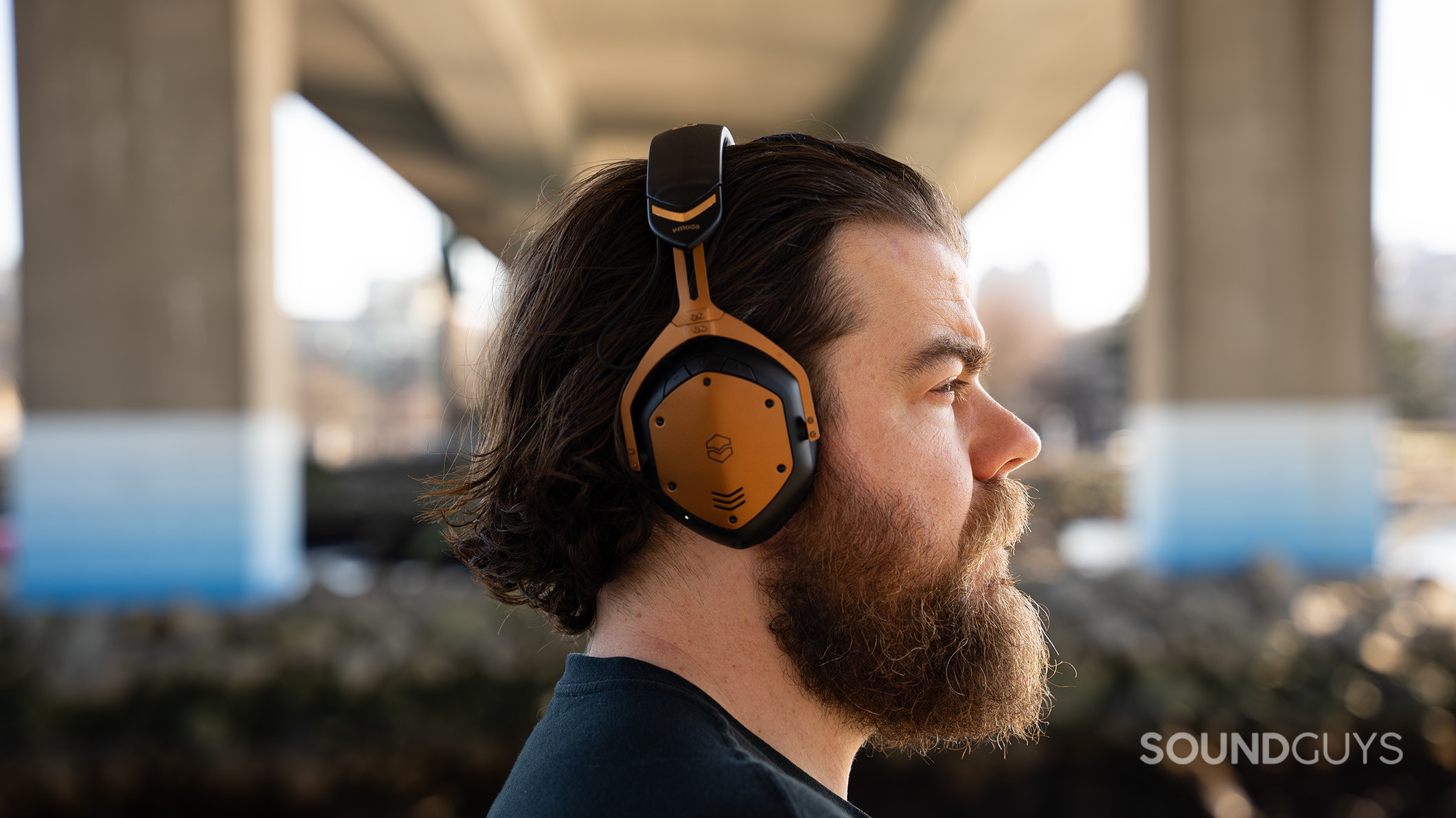 A man wears the V-MODA Crossfade 3 Wireless headphones.