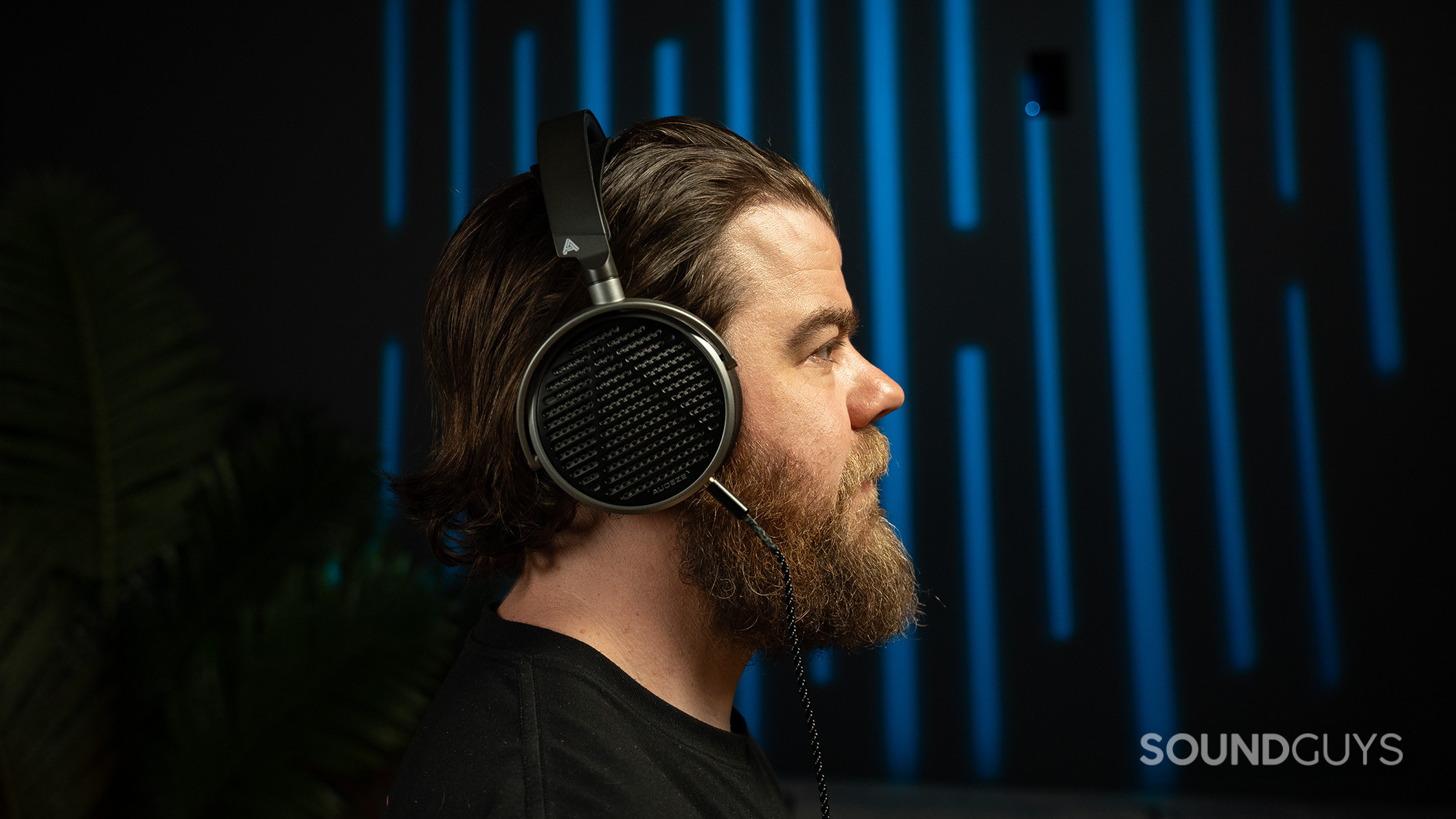 Audeze MM-100 on man facing right. 