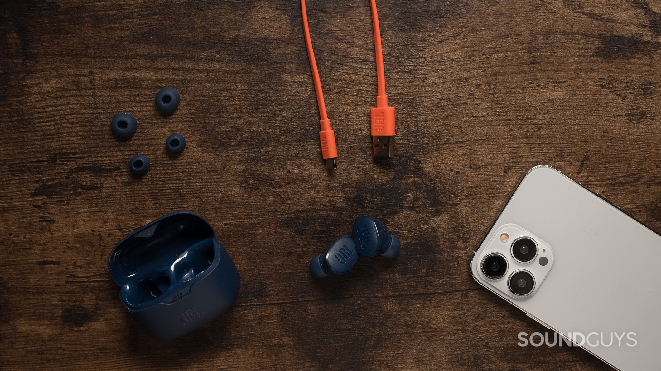 JBL Tune Buds with the extra ear tips and charging cable. 