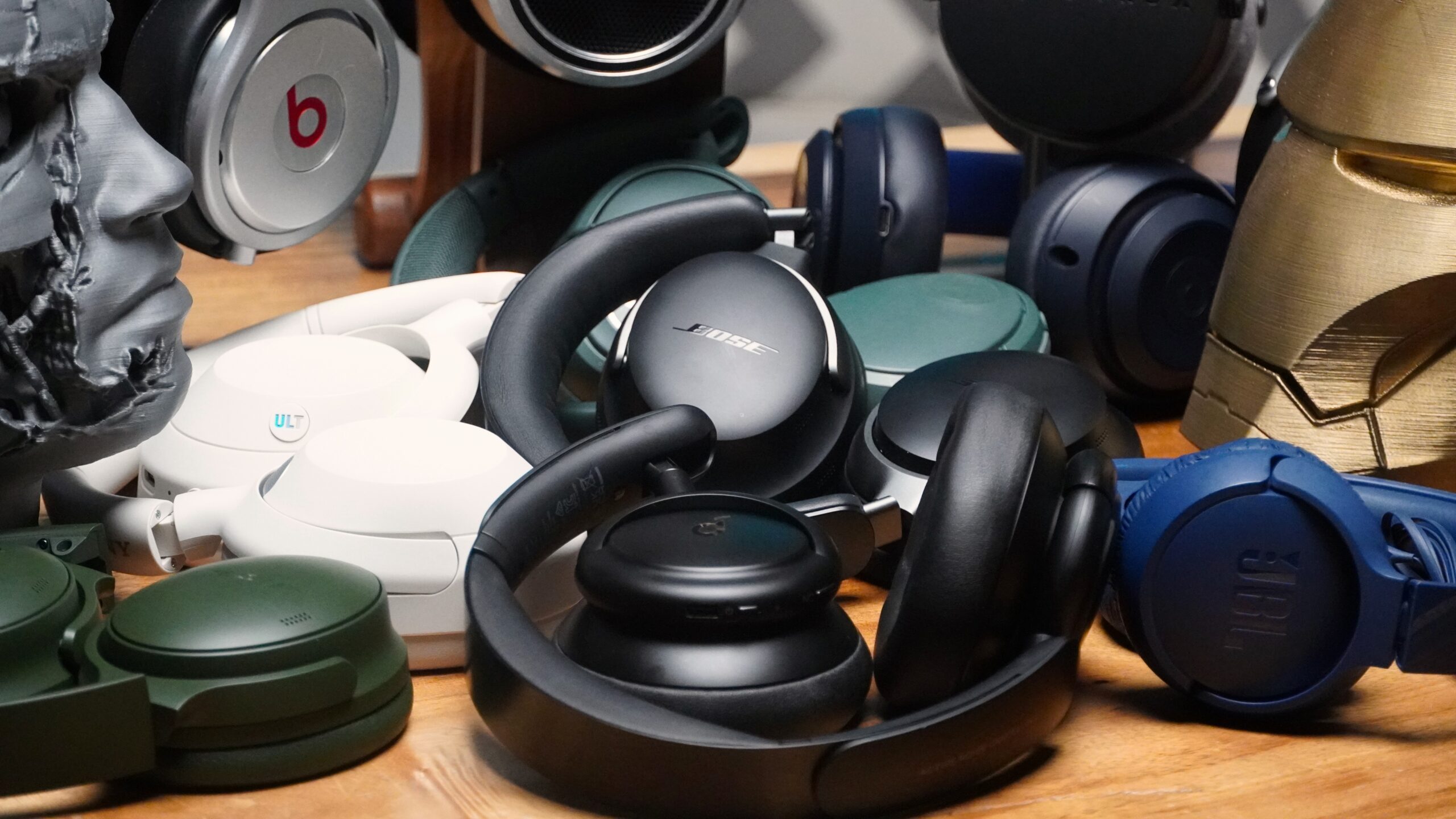 a close up of several headphones laying on a table