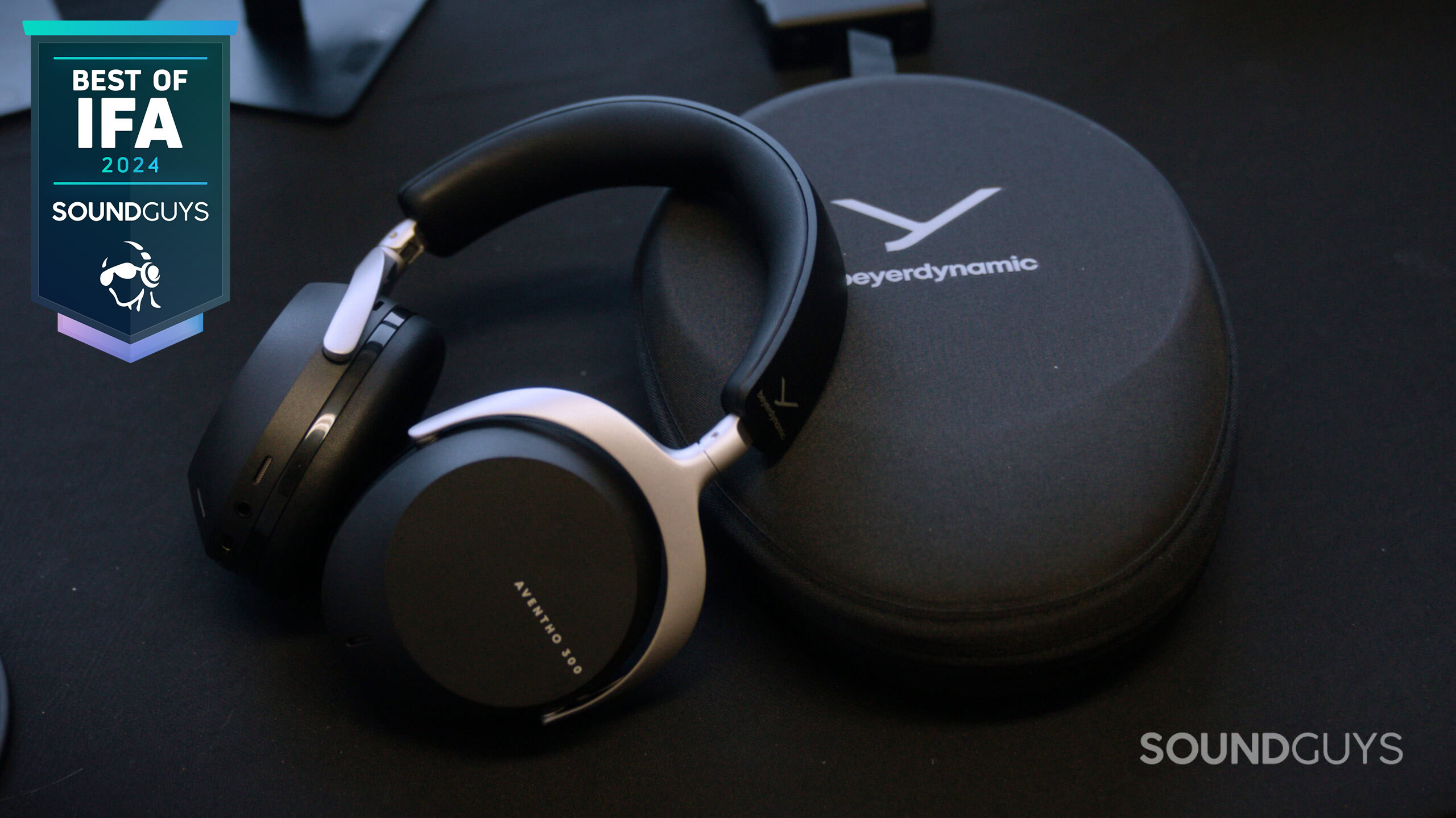 IFA-2024-Beyerdynamic-Aventho-300-black-leaning-on-carrying-case-scaled Beyerdynamic AVENTHO 300 headphones next to their carrying case.