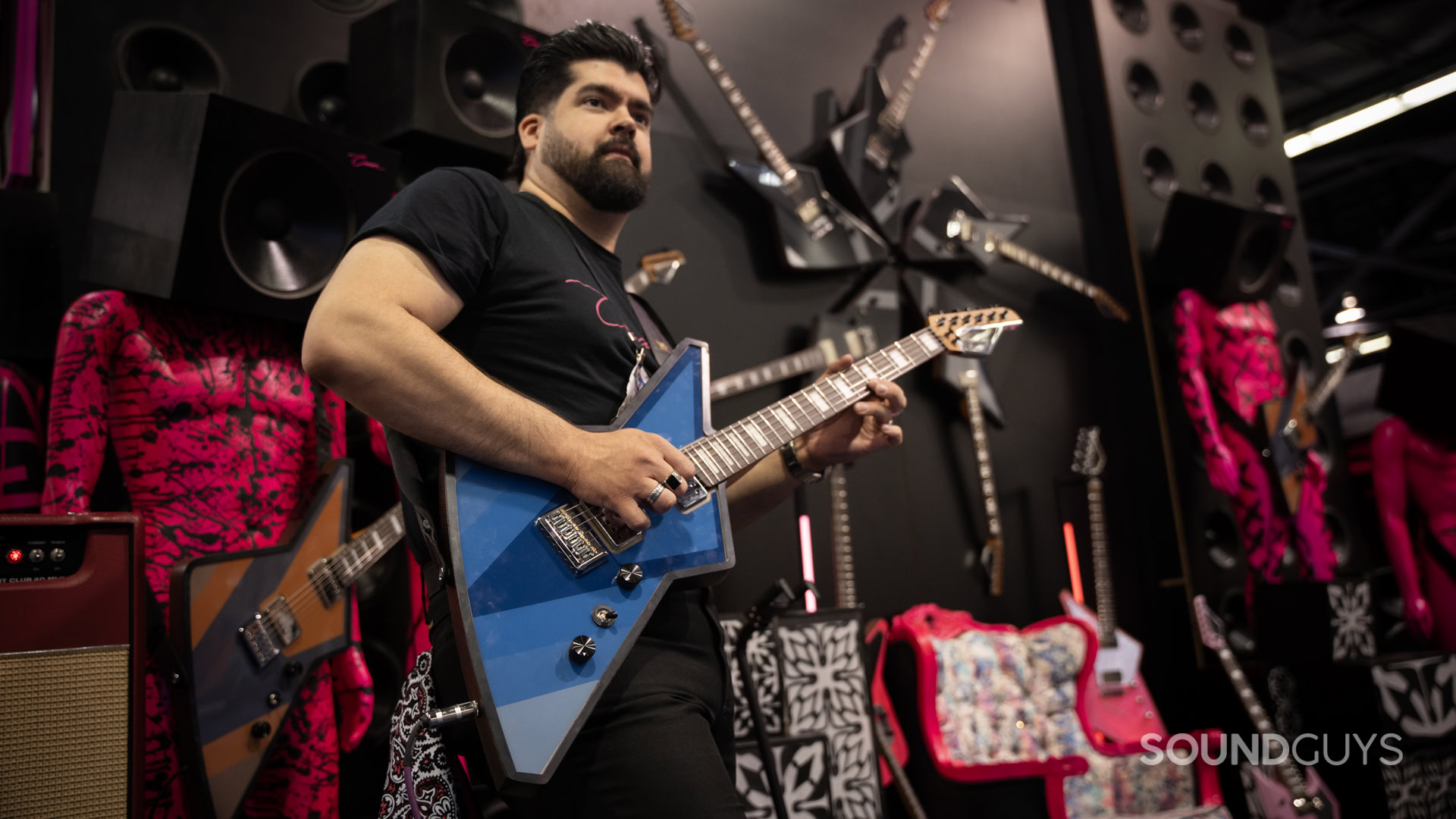A man plays guitar.