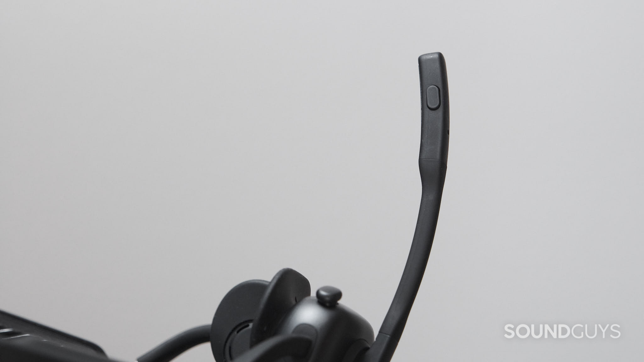 Shokz OpenMeet UC-mic button The Shokz OpenMeet UC microphone button.