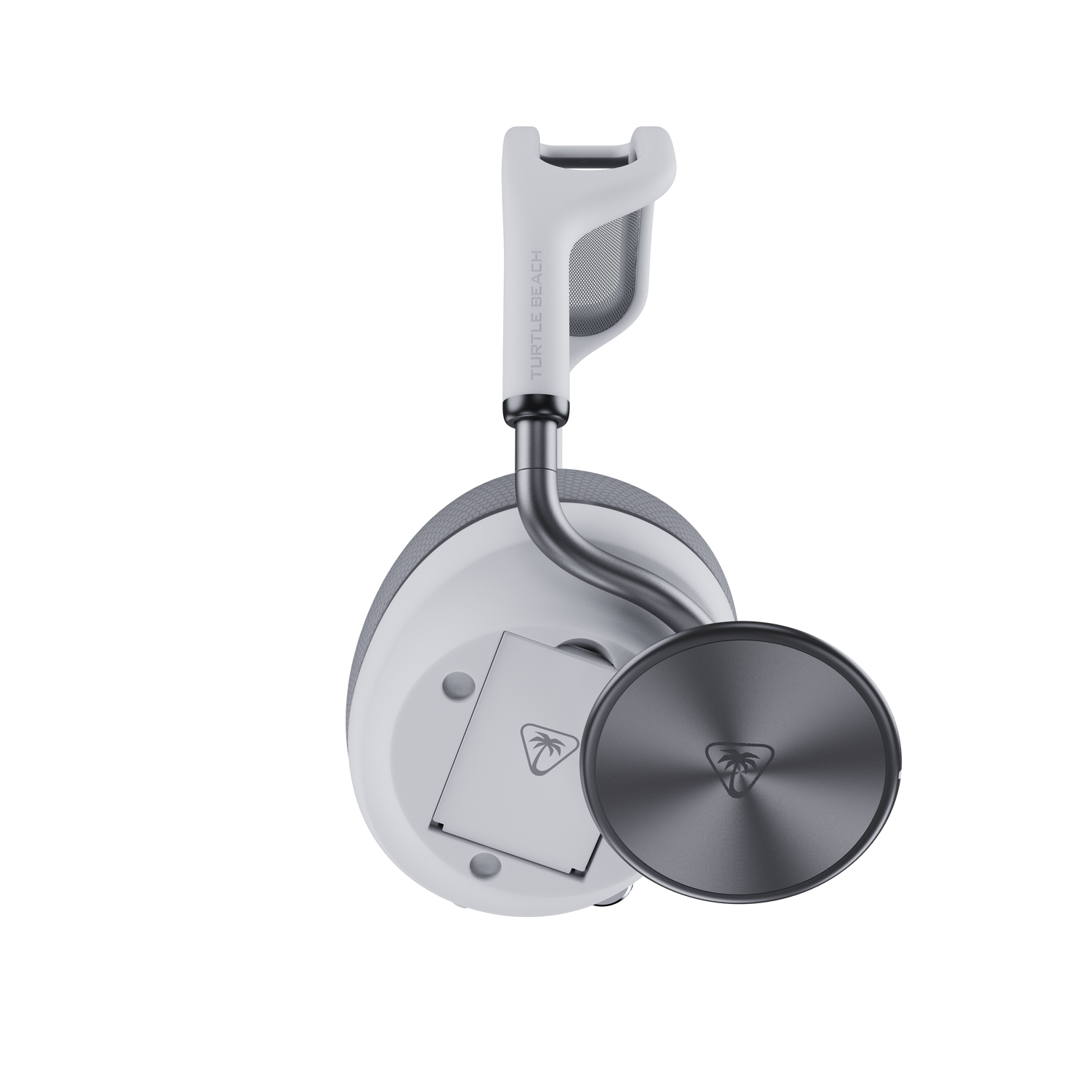 Close-up of Turtle Beach Stealth Pro 2 earcup with magnetic cover removed, showing removable battery inside and outer plate beside it.