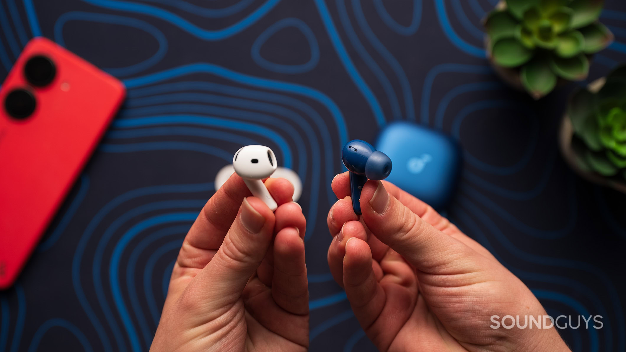 Anker Soundcore Liberty 5 next to Apple AirPods 4 eartips Anker Soundcore Liberty 5 earbud next to Apple AirPods 4 earbud.