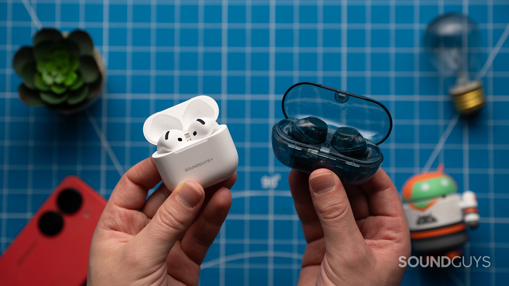 Sony WF-C710N and AirPods 4 case open Sony WF-C710N earbuds in case next to AirPods 4 with ANC earbuds in case.