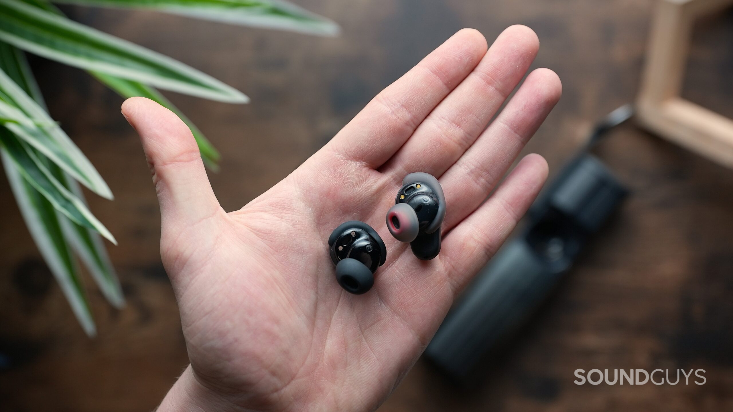 skullcandy vs bose earbuds in hand skullcandy vs bose earbuds in hand