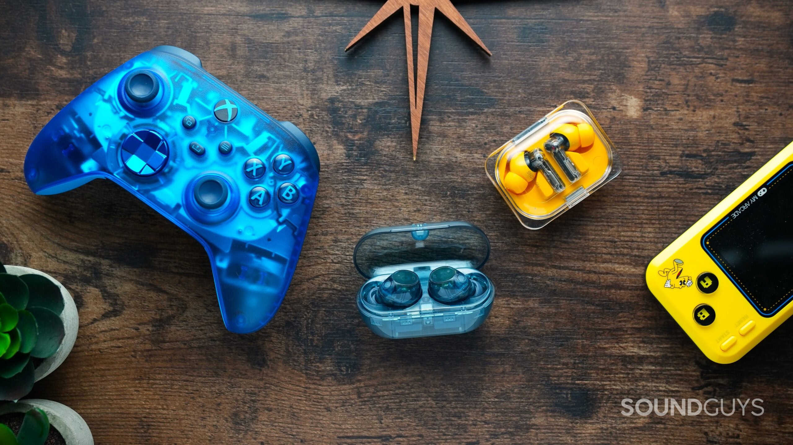 transparent tech transparent blue xbox controller with earbuds