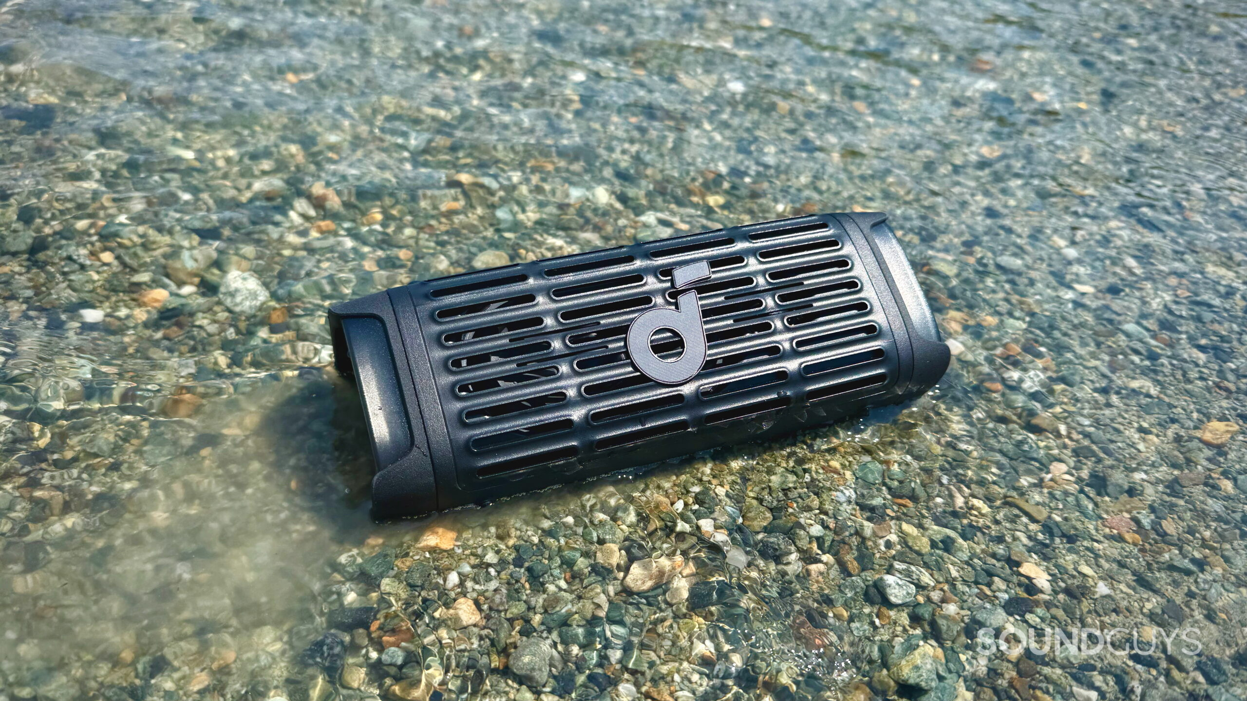 Soundcore Boom 3i placed in a river.