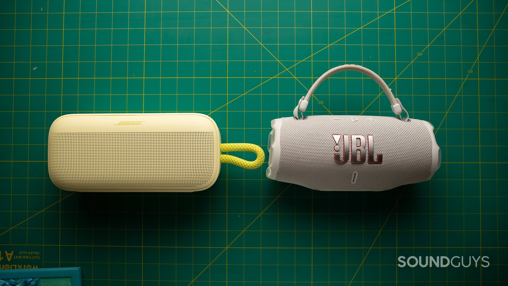 Bose SoundLink Plus vs JBL Charge 6 grills A Bose SoundLink Plus next to a JBL Charge 6