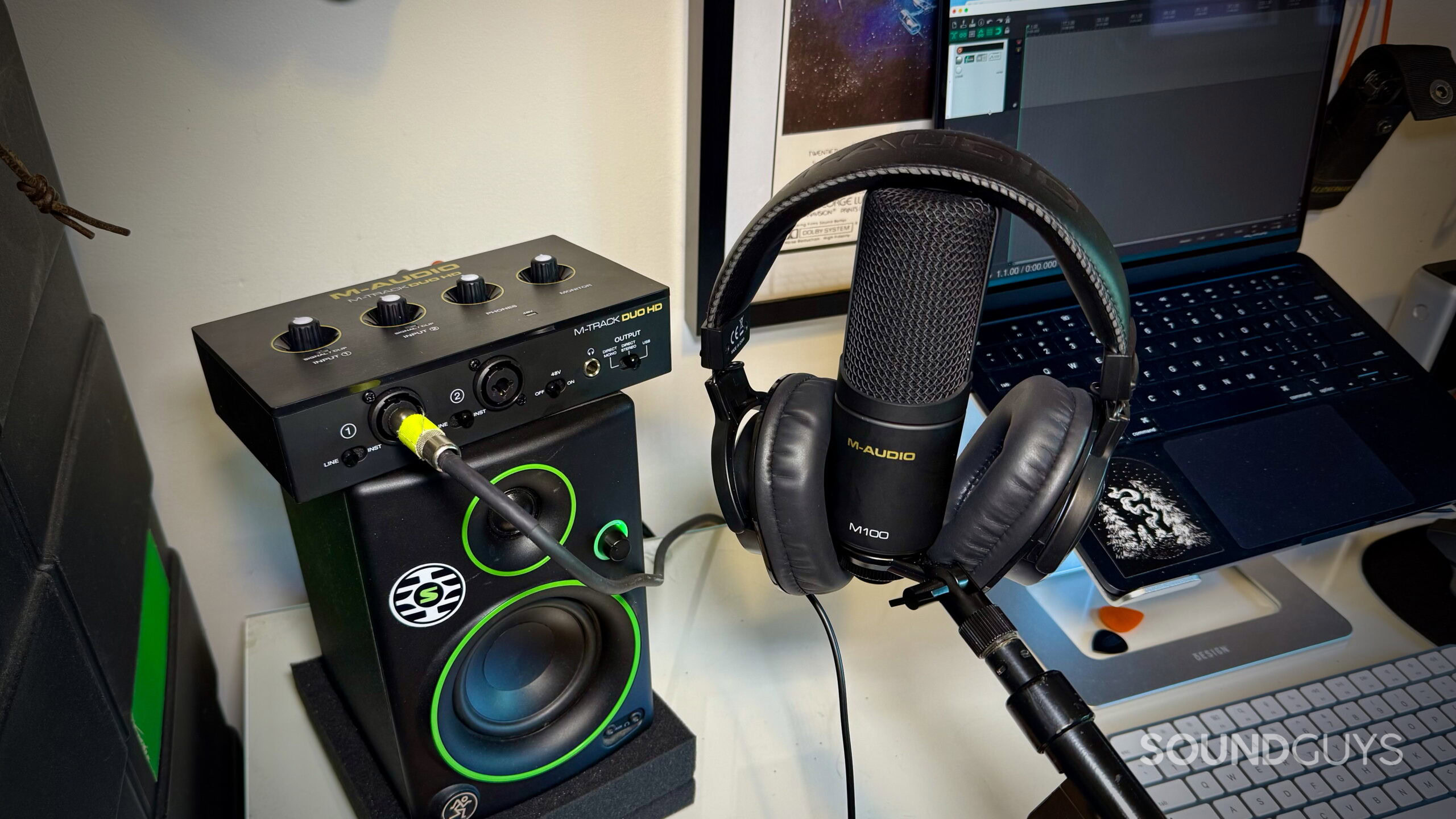 MAUDIO V.2 - 6 M-Audio M-Track Duo HD interface package on a desktop, showing its the headphones, interface and mic.