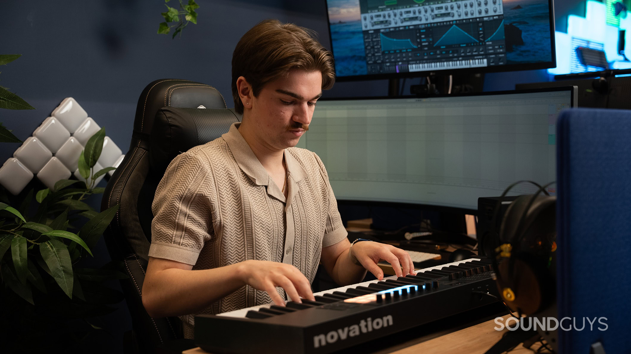 Novation Launchkey 61 MK4 playing 4 A man playing the Novation Launchkey 61 MK4 keyboard.