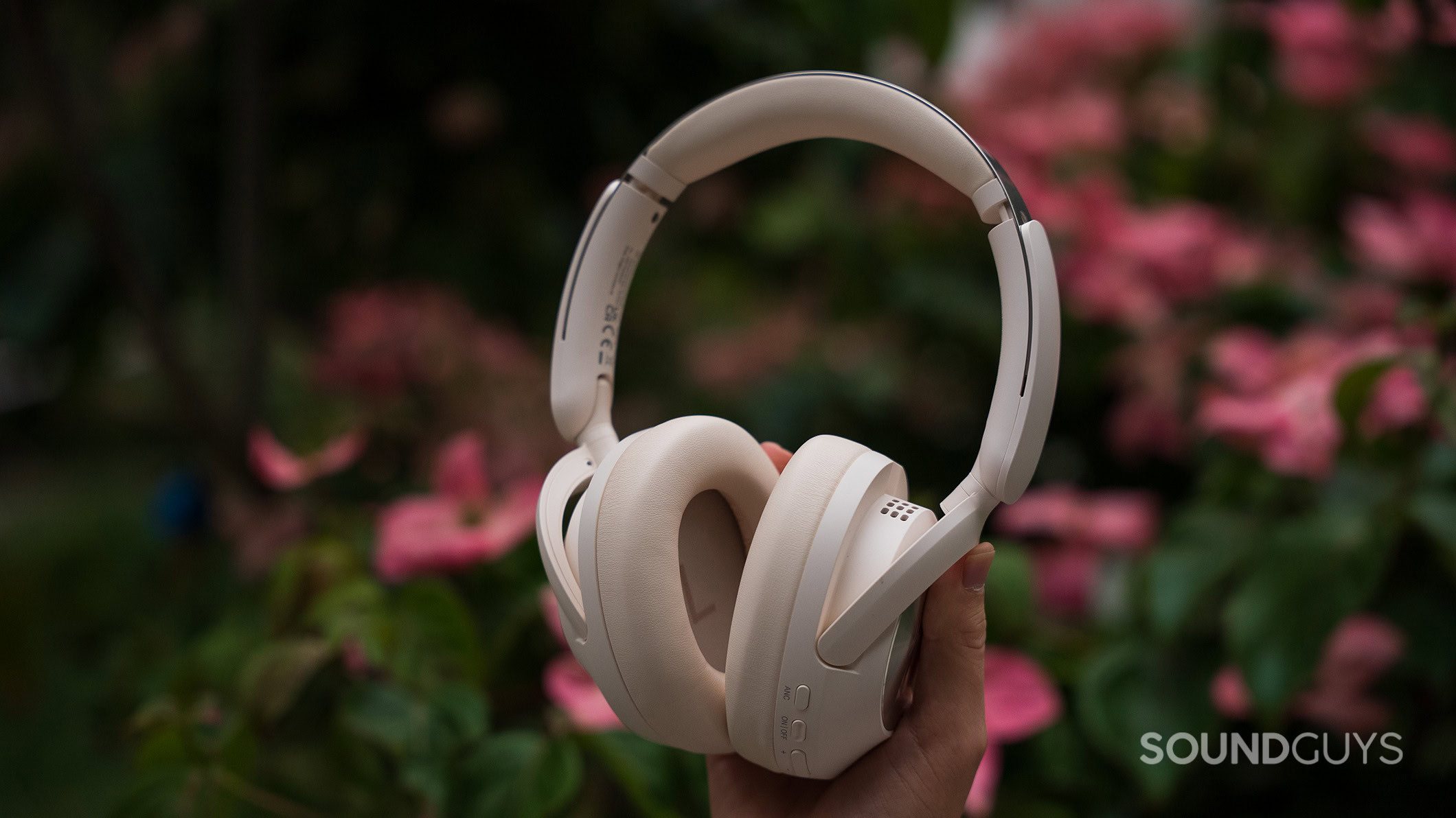 OneOdio Focus A6 headphone outside 2 OneOdio Focus A6 headphones held in a hand outside.