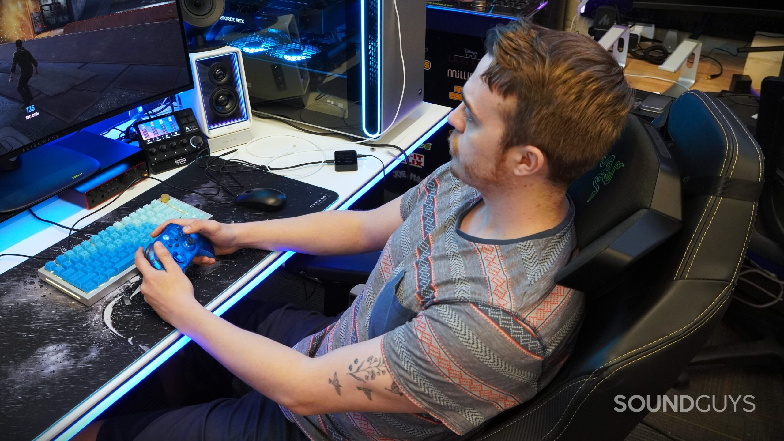 gaming with the razer clio a man gaming with the razer clio speaker