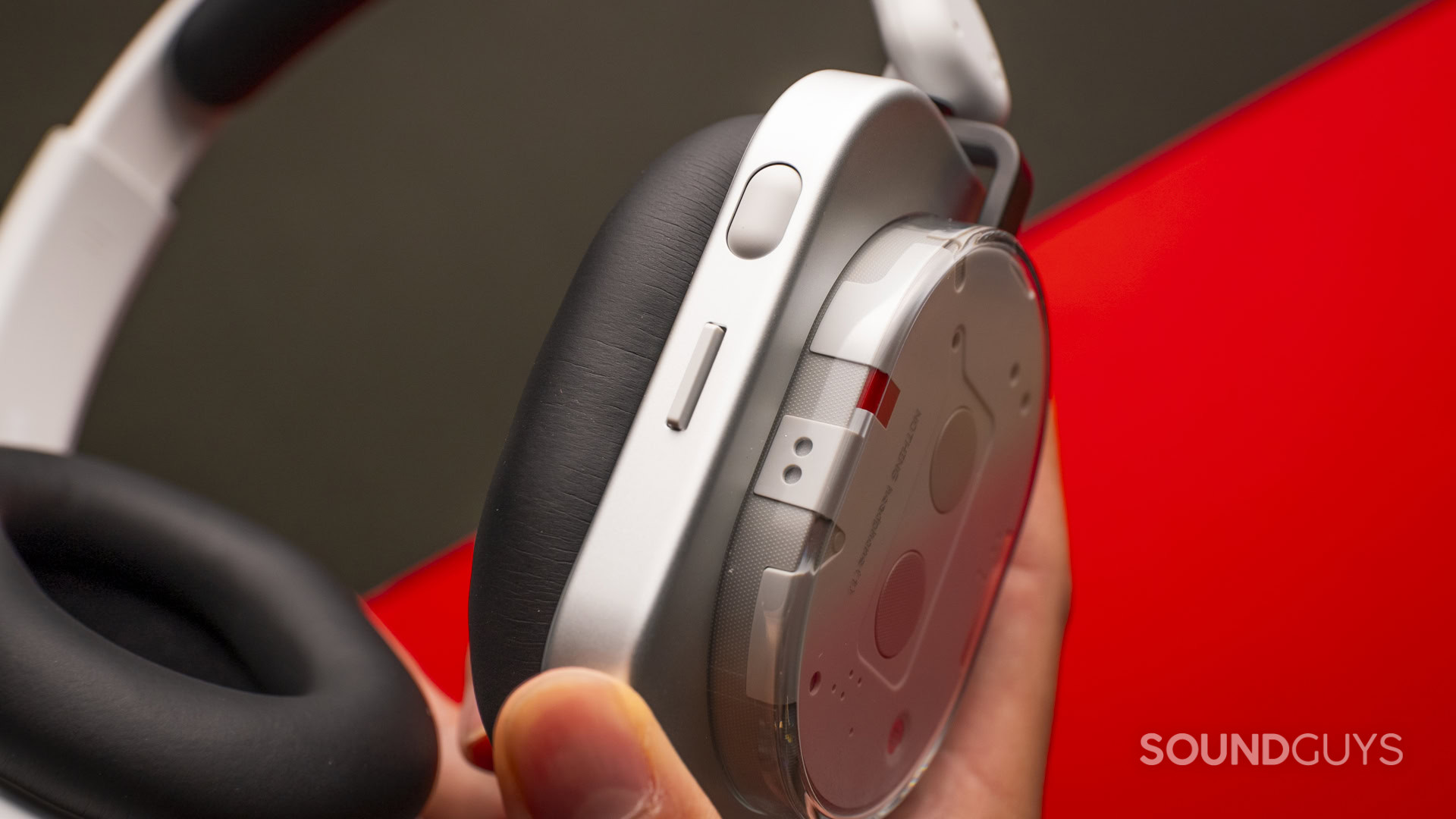 nothing-headphone-1-side-profile-holding-controls_4 nothing-headphone-1-side-profile-holding-controls