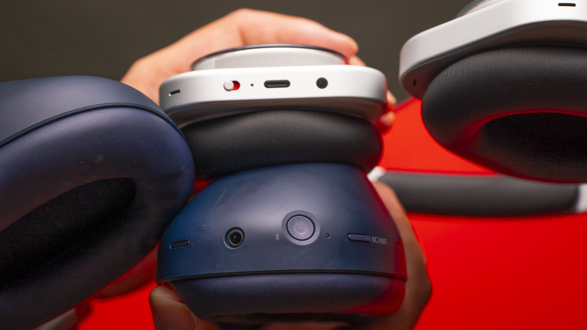 A photo of the Nothing Headphones (1) vs. Sony WH-1000XM6's ports.
