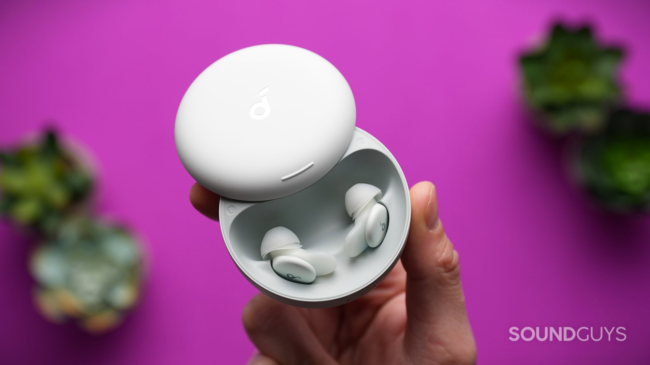 a hand holding the soundcore sleep a30