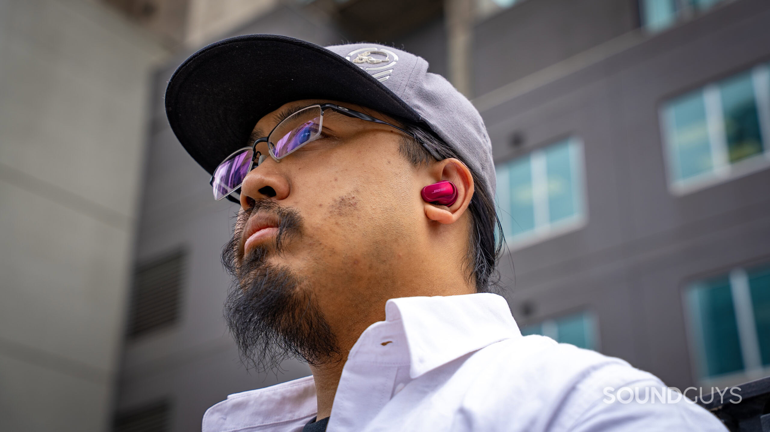 a man wearing the Bose QuietComfort Ultra Earbuds (2nd Gen)