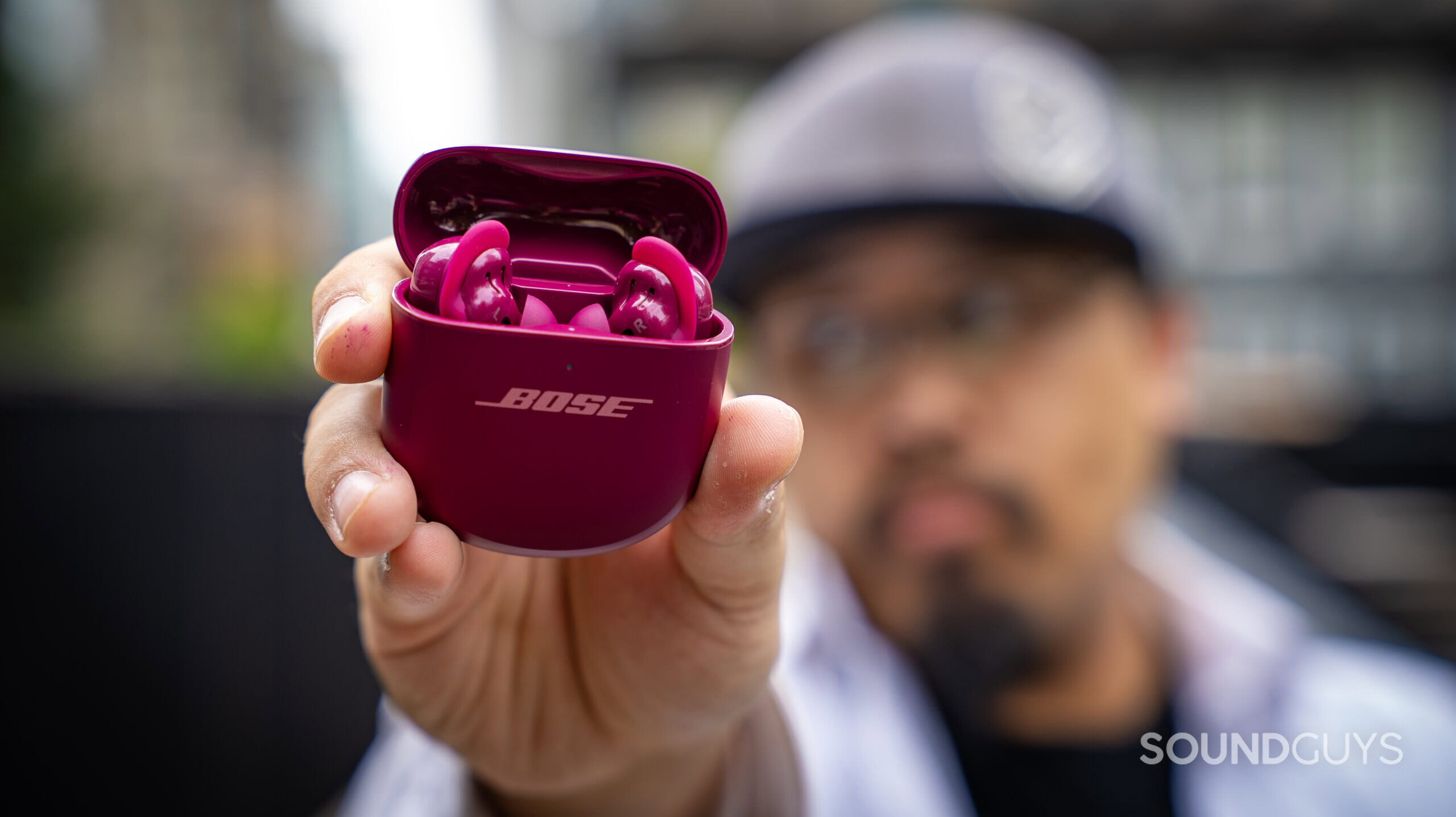 Bose QuietComfort Ultra Earbuds (2nd Gen)_33 a man holding the bose qc ultra earbuds 2