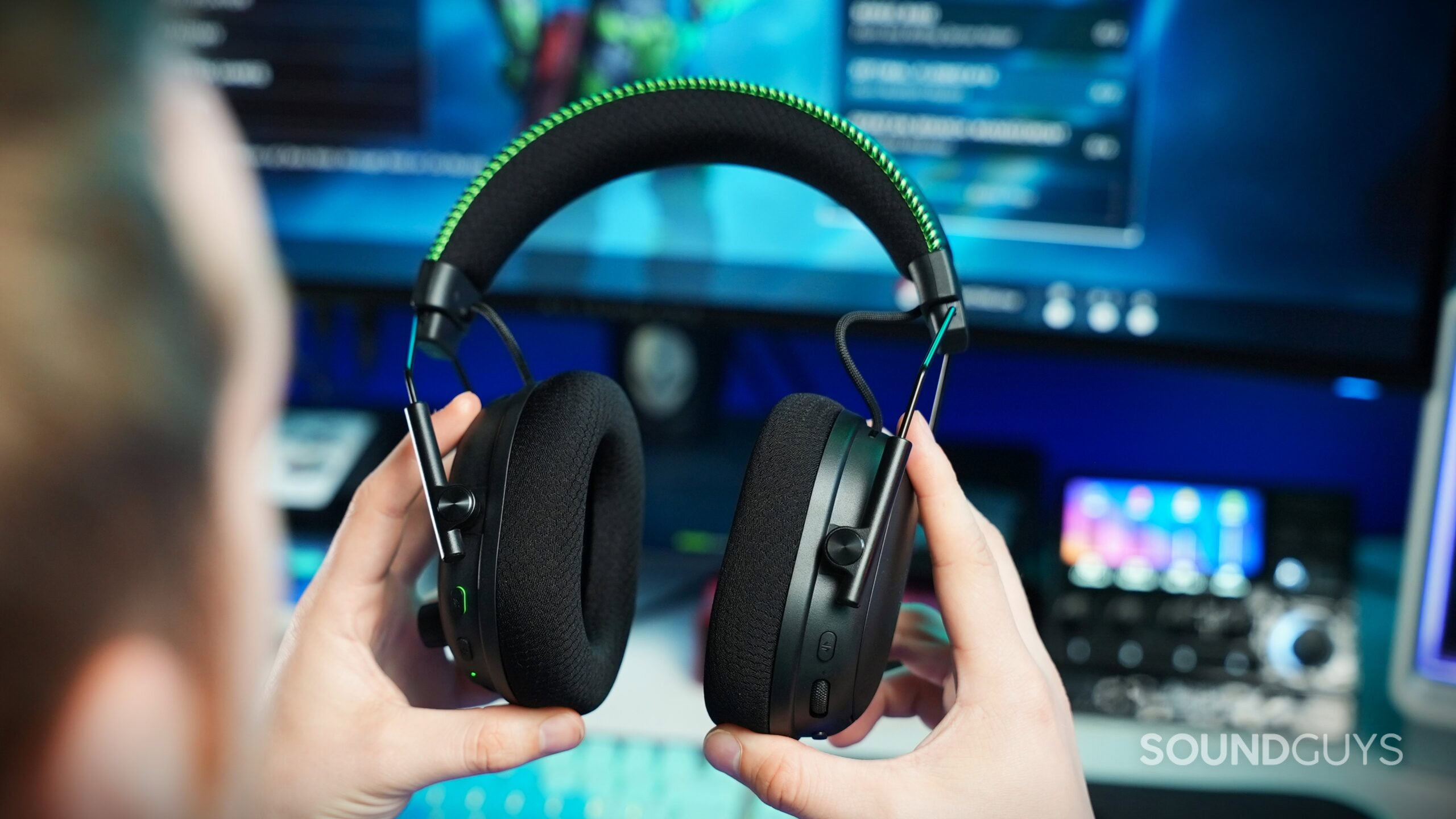a man holding the razer blackshark v3 pro a man holding the razer blackshark v3 pro