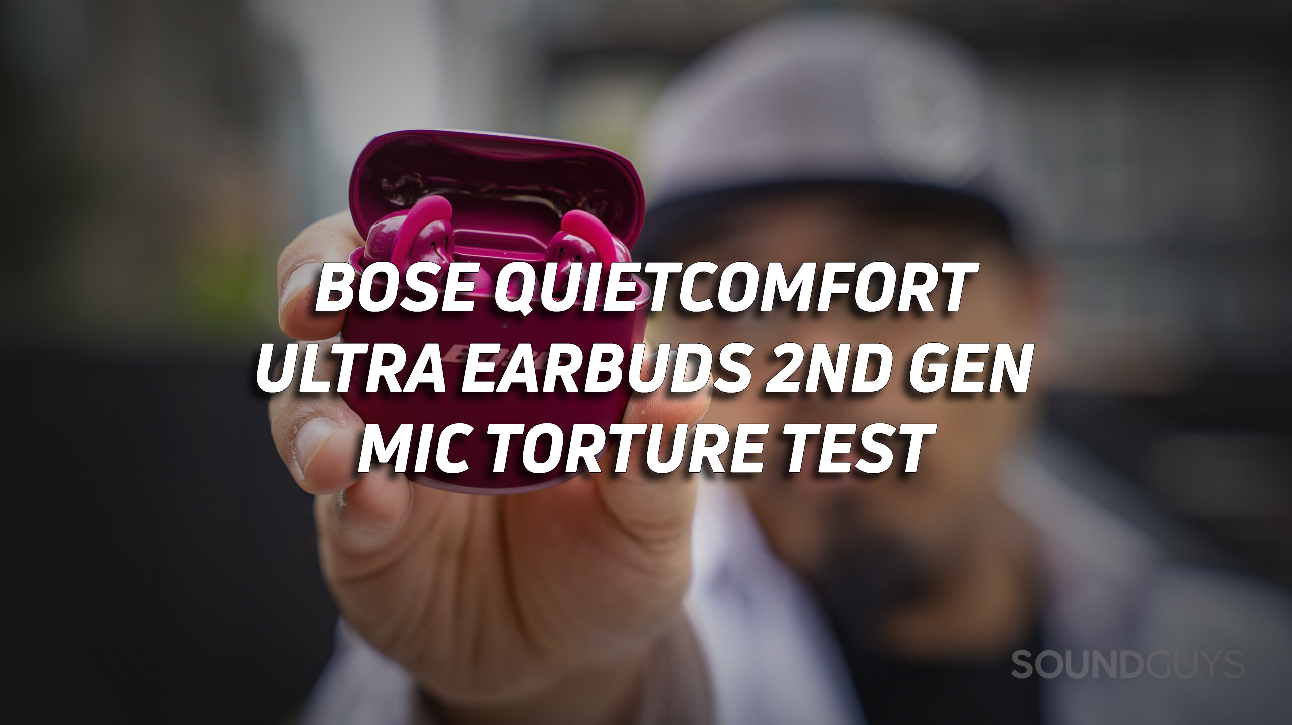bose-quietcomfort-ultra-earbuds-microphone-torture-test-hero A photo of a man holding the Bose QuietComfort Ultra Earbuds (2nd Gen), with the text "Bose QuietComfort Ultra Earbuds (2nd Gen) mic torture test" overlaid.