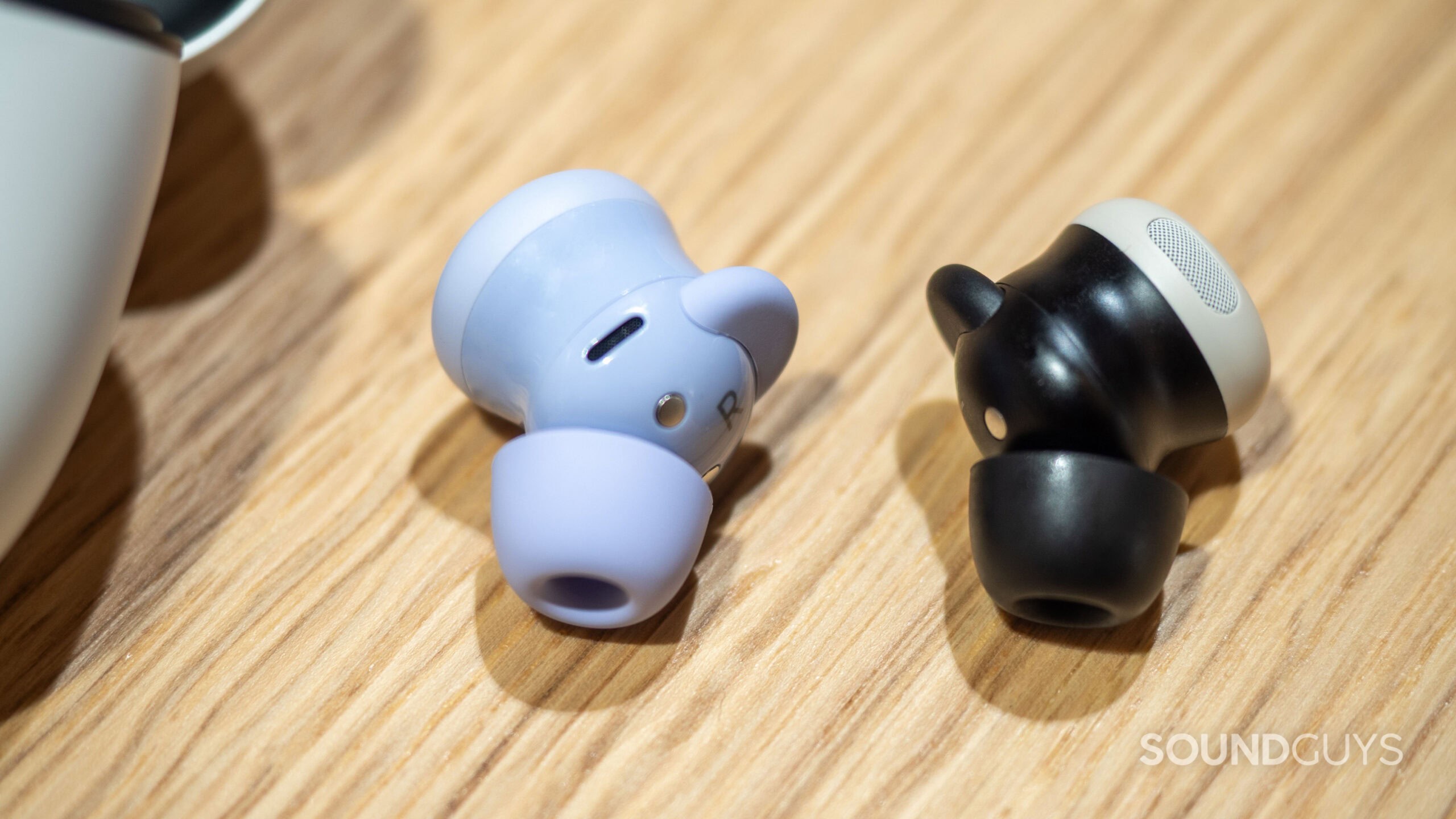 google-pixel-buds-2a-vs-pixel-buds-2-pro-1 Google Pixel Buds 2a next to Google Pixel Buds Pro 2 earbuds.