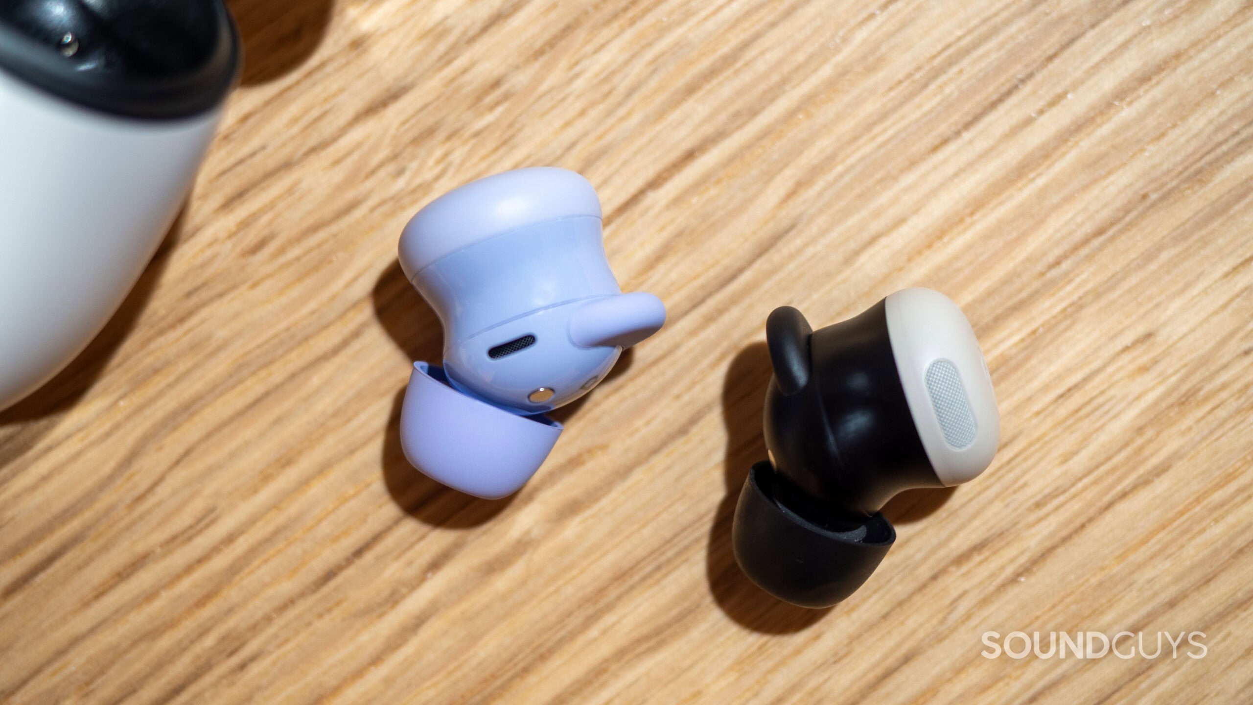 Google Pixel Buds 2a next to Google Pixel Buds Pro 2.