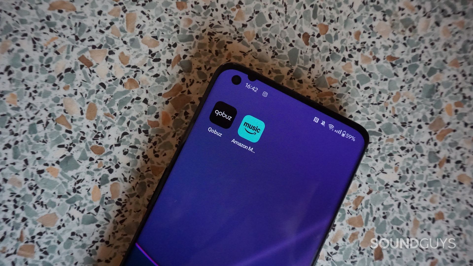A photograph of the Qobuz and Amazon Music Unlimited apps on Android.