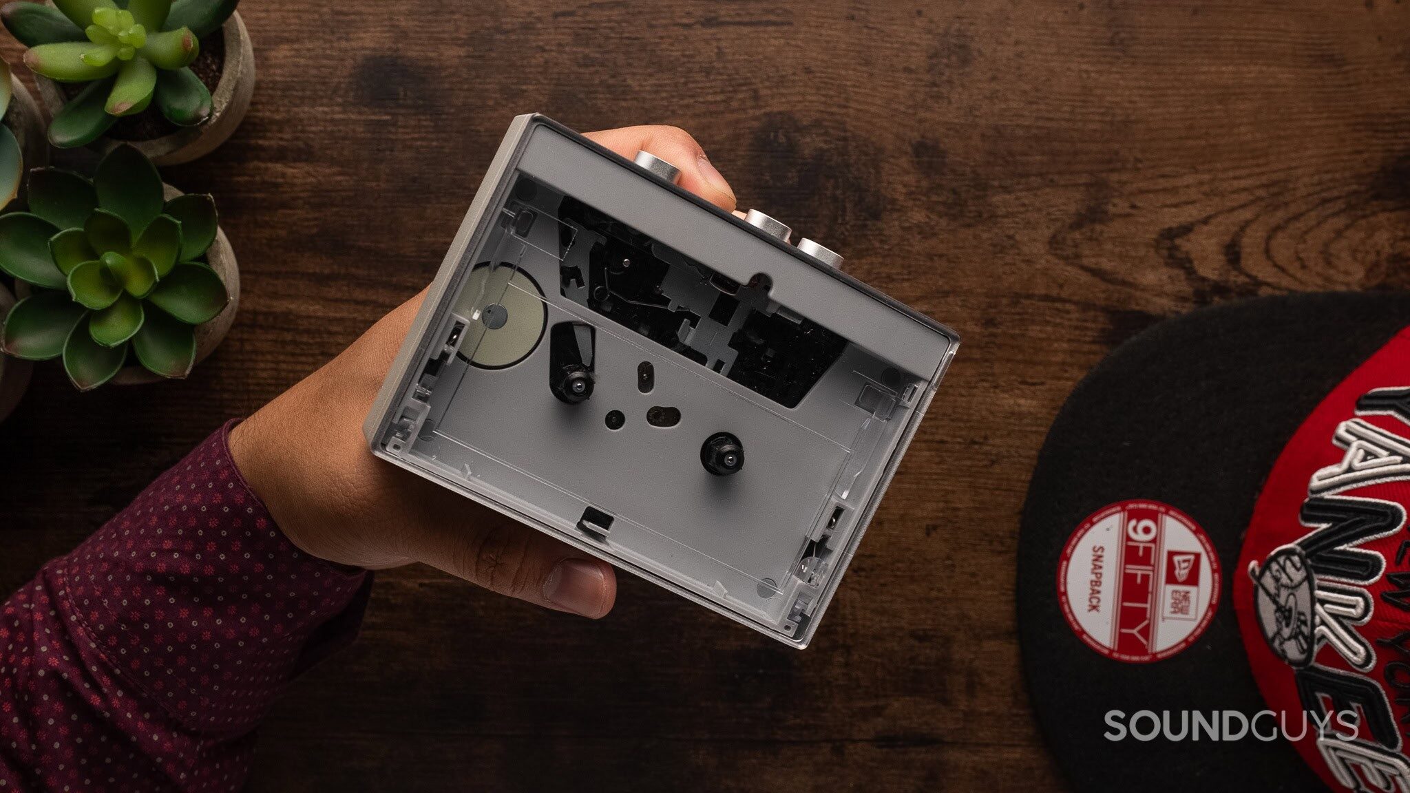 FiiO CP13 A portable cassette player sits on a table.