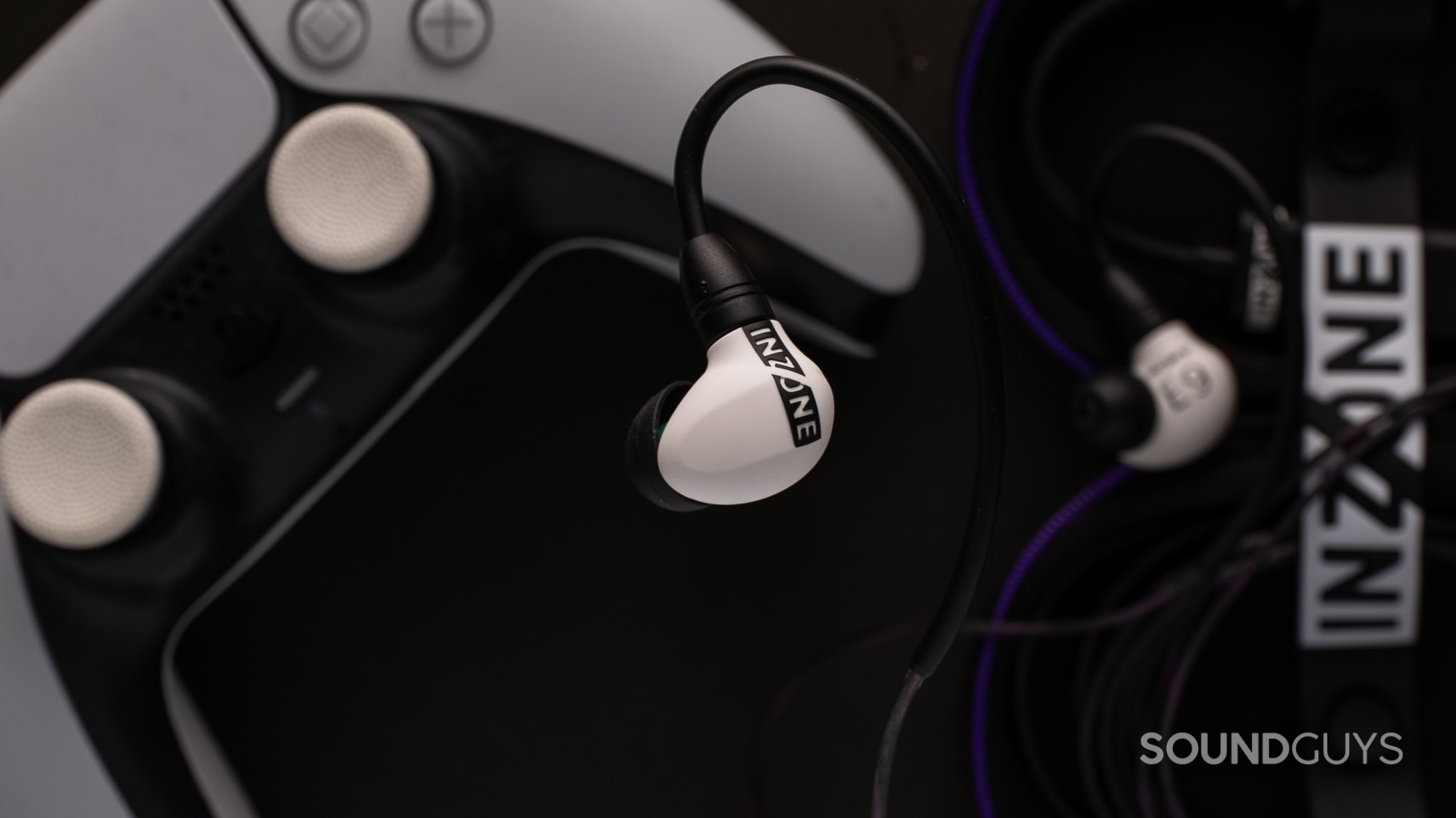 Sony E9 close up top down Sony e9 topdown shot on dark background with playstation controller in background