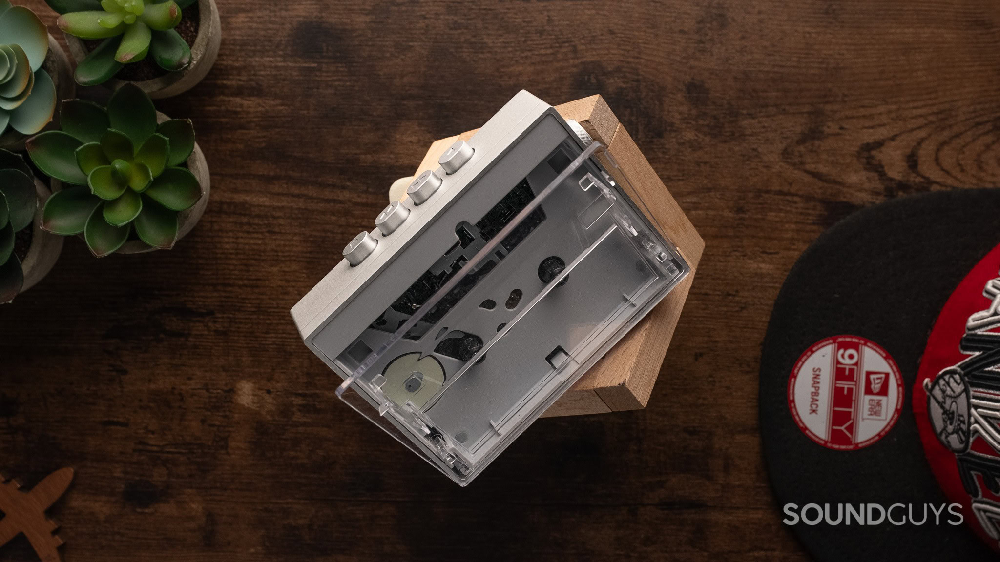 FiiO CP13 A portable cassette player sits on a table.
