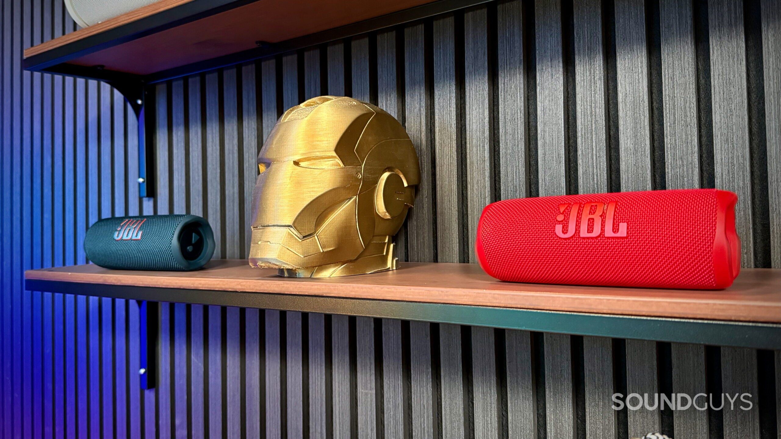 Flip 6 Article - 4 Two JBL Flip 6 units placed on the left and right side of an Iron Man 3D printed head.