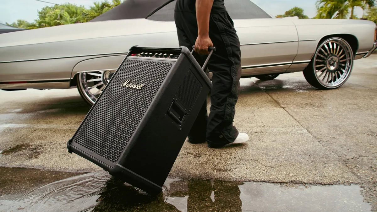 Marshall 750 - 1 The Marshall Bromley 750 party speaker being rolled by a man