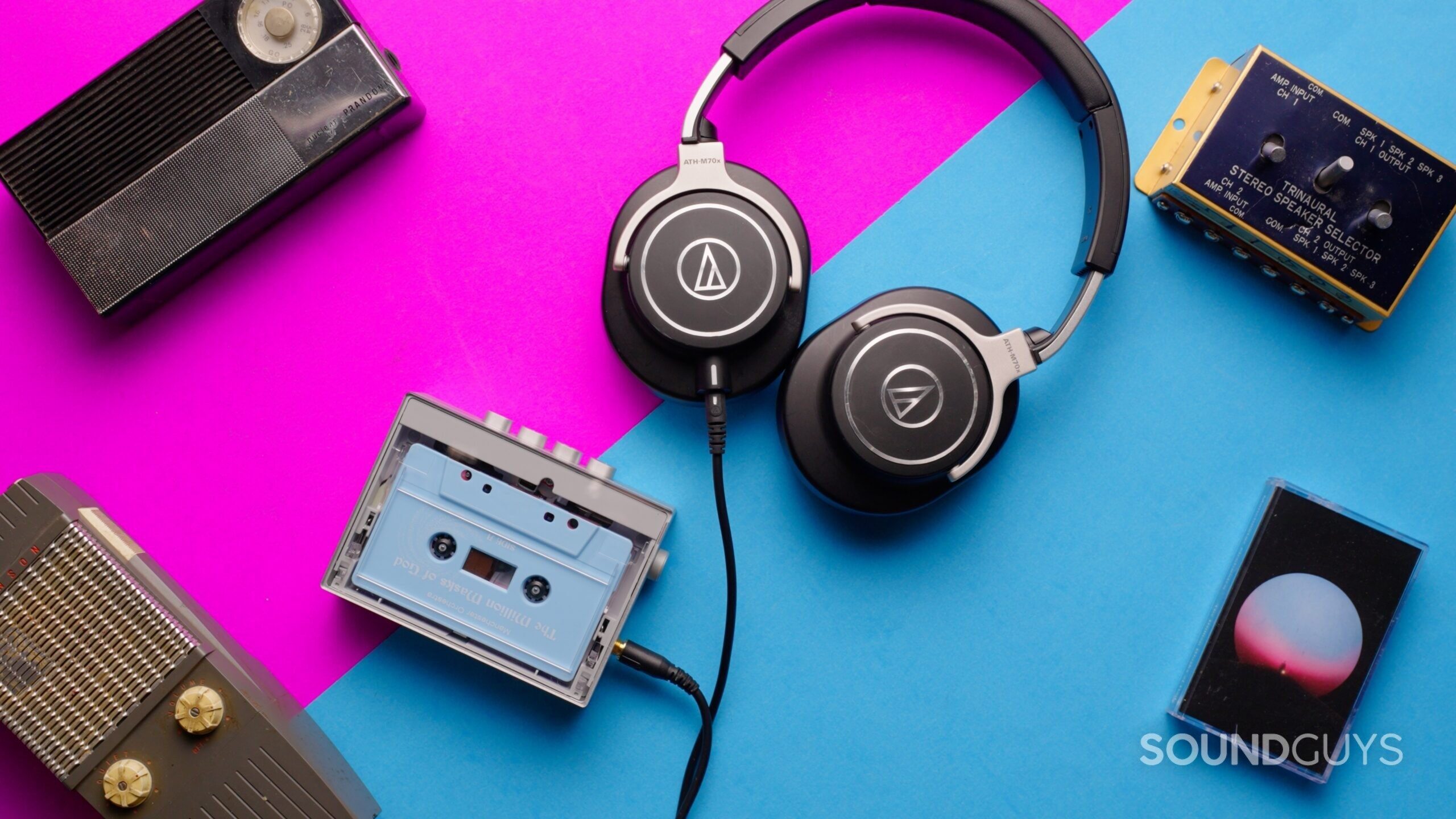 THUMBNAIL3 A variety of vintage tech along with a cassette player and a pair of headphones.
