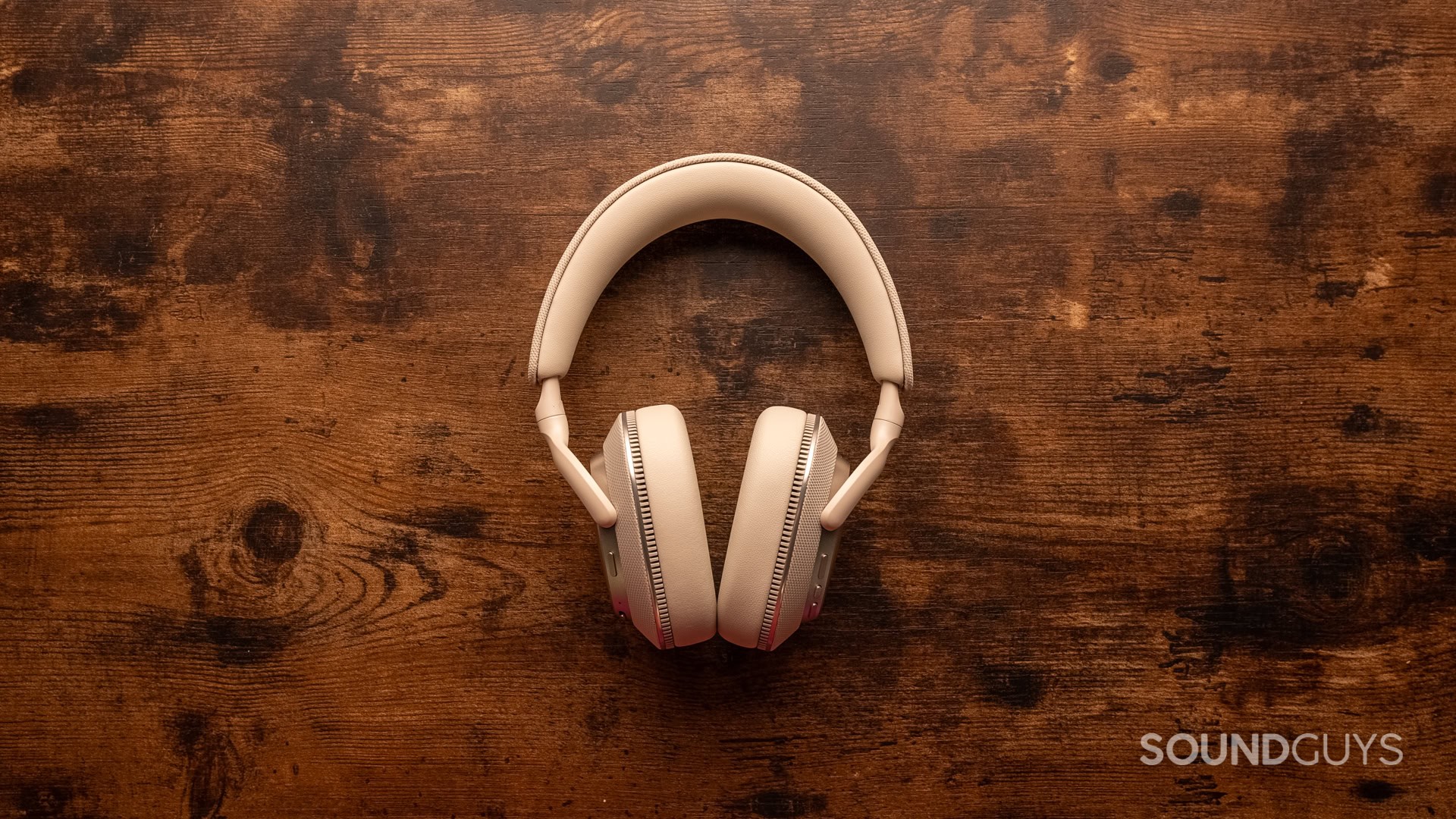 A photo of the Bowers & Wilkins PX7 S3 on a wooden desk.