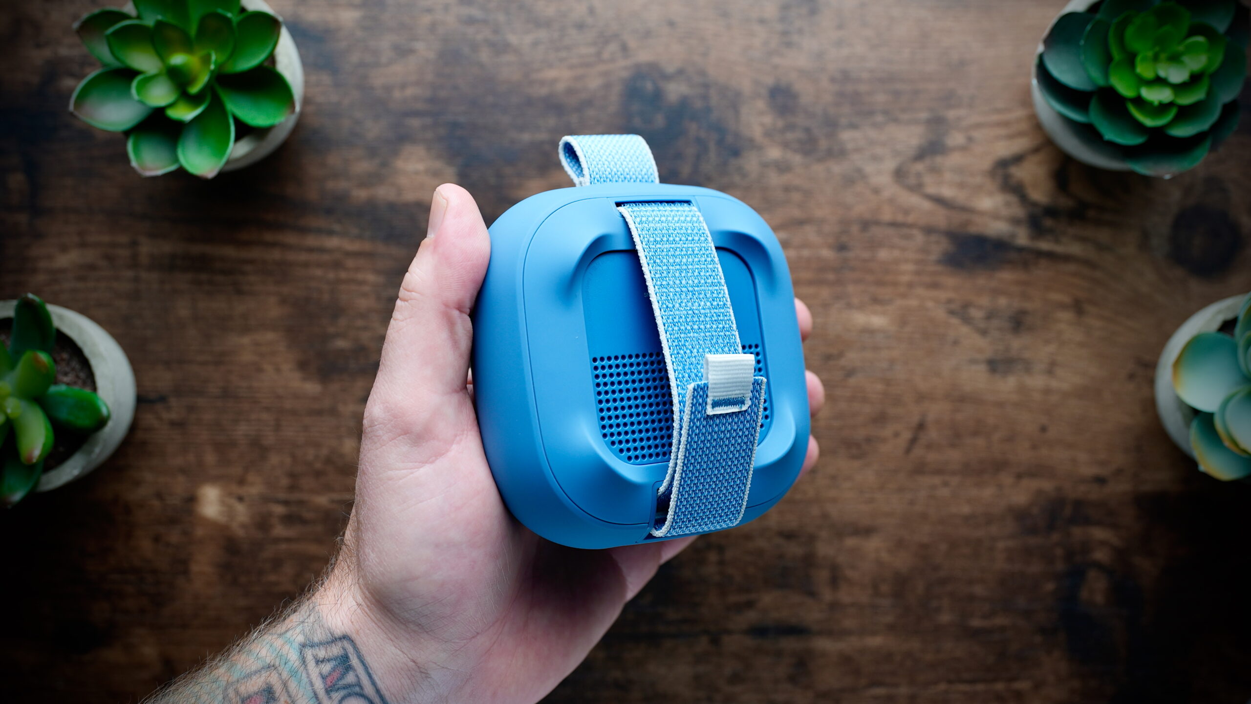 Rear view of the Bose SoundLink Micro 2, showing its attachment strap.