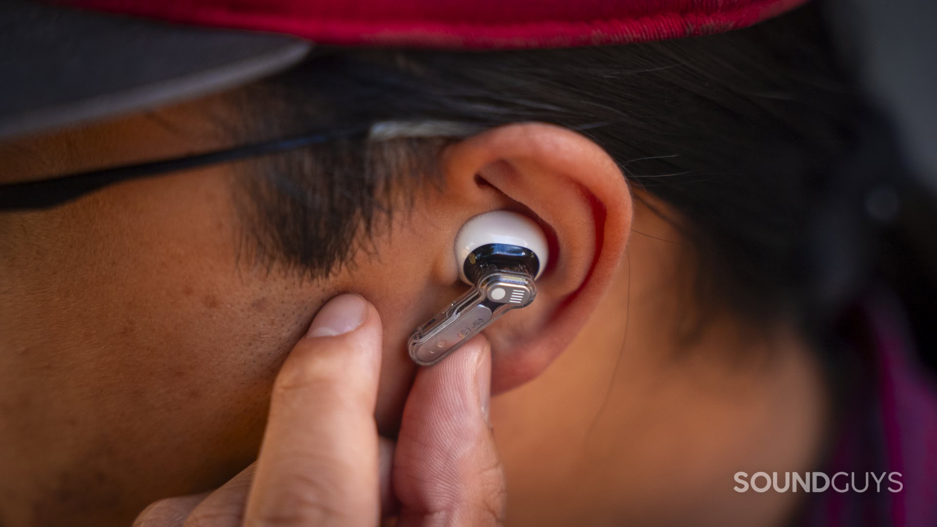 a man using the pinch controls on the nothing ear 3